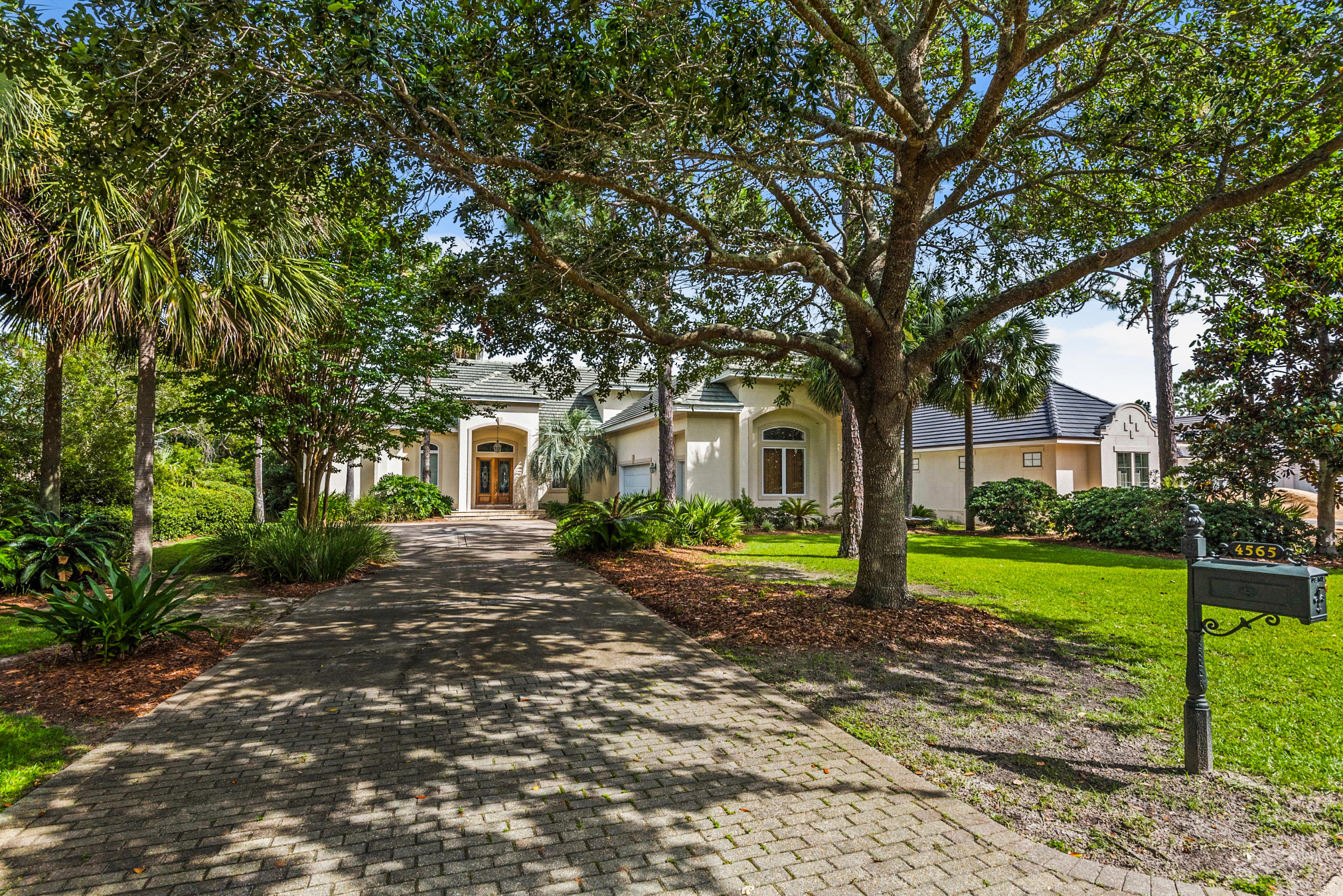 Exceptional location and view from this Lake home. Over sized lanai with pool and grilling area. Fish out your back door. The home features 2 full kitchens. One of the lowest priced homes per sq ft in Regatta Bay. Entrance has double mahogany doors with custom designed leaded glass. Formal living area and open dining room with soaring treyed ceilings. Family room overlooks the pool & Lake. Open family room has separate granite wet bar with sink, ice maker, wine cooler & wine storage. 2 gas fireplaces - crown molding & 14 ft ceilings. Gourmet kitchen offers side by side fridge, large granite breakfast bar, custom cabinetry, double oven. Master suite features treyed ceiling, 2 overhead sconces, sliding doors that open to the pool. Double vanity, tile floors, walkin closet. 1st floor