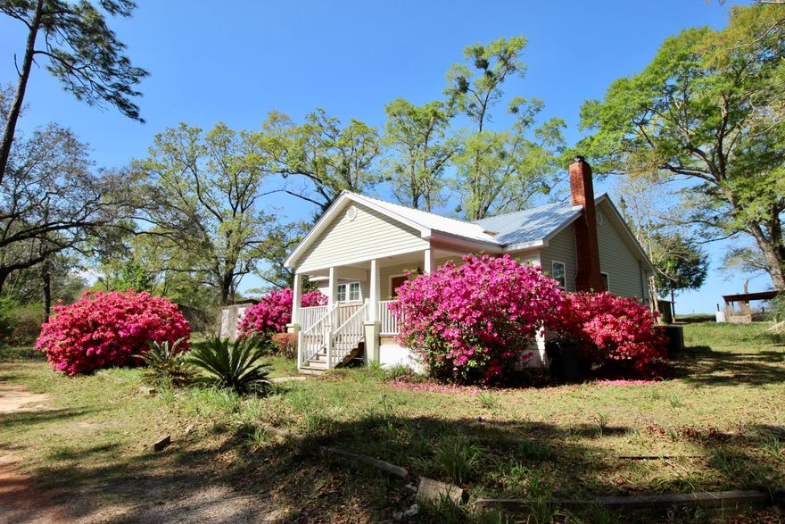 Currently under contract with 72 hr kick out clause - seller will only consider full price or over cash back-up offers. Florida cottage, tucked away in a sanctuary of azaleas, under a canopy of live oaks. The front porch invites you to sit & stay a while. Home has been updated without losing its alluring southern charm. A new metal roof in 2020 & updates 9 years ago including: kitchen & bath updates, new wiring, new plumbing, new windows, HVAC & attic insulation. Kitchen is spacious with room for an island. There's a flex room which could be a 3rd bedroom or office. Hardwood floors are tucked away under the vinyl. House is nestled on 1.4 acres with front & back porches, 2 sheds, a chicken coop & an old fashioned barn. Just 15 minutes to I-10 & downtown DeFuniak and only 45 min to the beac