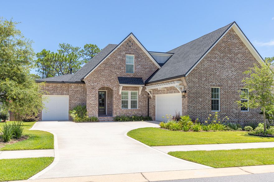 *Now offering $10,000 closing cost credit* Experience the inviting lifestyle of Deer Moss Creek, a walkable community known for its scenic nature trails and neighborly charm. This all-brick custom Randy Wise home offers five bedrooms, a dedicated office off the foyer, and a peaceful wooded backyard that provides both space and connection. LIKE NEW now offering a 1-year home warranty. Eligible for VA loan assumption at a 5.75% interest rate for qualified buyers.Inspired by the sought-after Daphne floor plan, this home features thoughtful upgrades and exceptional craftsmanship throughout. Distinctive architectural curves and a covered entry create a welcoming first impression, leading into an open-concept layout that blends stylish design with practical living. A statement gas fireplace with custom built-ins anchors the living room, creating a seamless transition into the dining area and gourmet kitchen. The kitchen impresses with professional stainless steel appliances, custom cabinetry accented by lighting, a farmhouse sink, and a spacious walk-in pantry. A large island takes center stage, offering ample space for gatherings and meal prep.

Retreat to the first-floor primary suite, where an expanded bathroom with separate shower and tub invites relaxation. A generous walk-in closet connects directly to the laundry room for added convenience. Nearby, a guest bedroom with its own en suite provides comfortable accommodations, while a drop zone and epoxy-finished attached garage round out the main level.

Rich hickory hardwood flooring continues from the main level into the upstairs bonus area, a versatile space ideal for a home office, playroom, or media room. Three additional bedrooms and bathroom offer ample living space, including access to a large unfinished storage area perfect for seasonal items or future expansion.

Equipped with smart features, the home offers pre-wiring for surround sound and a security system, plus eight professionally mounted televisions throughout. A home generator adds an extra layer of reliability and ease.

Outside, the screened-in porch includes a summer kitchen with wood accents, and a ceiling fan, making grilling and entertaining effortless. The open deck leads to a large fenced backyard backed by woods and surrounded by nature trails. The generously sized lot is just a short walk from the community pool, basketball courts, and clubhouse. Don't miss this opportunity to live in Deer Moss Creek, a masterfully planned 1,100-acre community.
