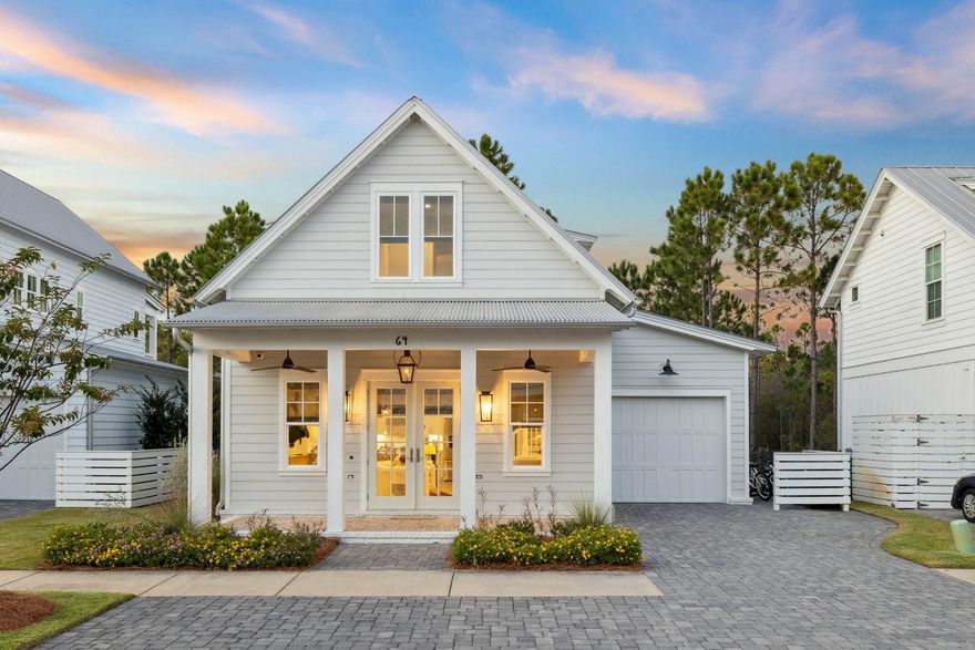 Tucked within a quiet, gated enclave surrounded by protected nature preserves, this 3BR, 3.5BA, offers the perfect combination of privacy, comfort, and coastal living. A former model home, it showcases premium builder craftsmanship where no detail was overlooked. Just a short walk or bike ride to the sugar-white sands of 30A, it has been meticulously maintained in a community that does not allow short-term rentals.The desirable master-on-main design offers comfort and privacy, while the upper level features a spacious loft and two additional bedrooms. One bedroom includes custom built-in bunk beds, perfect for guests or kids, and flex space between the bedrooms has been thoughtfully utilized as a work from home nook.Designed in a soft neutral coastal palette, this  home features stainless steel appliances, granite countertops, shaker-style cabinetry, crown molding throughout, shiplap accents, and custom woodwork. The main level is equipped with surround sound, and the outdoor living area includes a cozy gas fireplace ideal for relaxing evenings under the stars.
The garage is both functional and polished, featuring epoxy flooring and built-in shelving for added storage and organization.
Located within the gated Cottage Grove community, residents enjoy a neighborhood pool, beautifully landscaped common areas, and easy access to nearby walking and biking trails. Surrounded by nature yet just minutes from the sugar-white beaches, dining, and shopping on 30A, this home offers a rare blend of quality, comfort, and coastal charm and perfect for full-time living or a second home retreat.