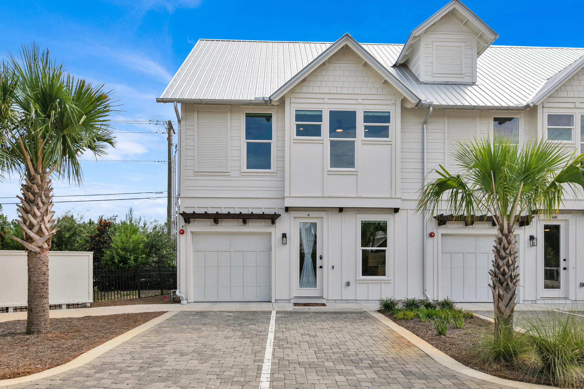 Welcome to the epitome of coastal living! This charming townhome is nestled within a small boutique community of just 7 units, perfect for your rental needs. Offering 3 spacious bedrooms, 3 and 1/2 baths, an additional bunk room area, and 1,935 square feet of heated/cooled living space, this residence provides a perfect blend of style and functionality. Inside, you'll find beautiful hardwood flooring, sleek quartz countertops, and charming accent walls that create an inviting atmosphere. The highlight of this home is the covered 3rd-floor outdoor living area, where you can unwind while taking in the serene surroundings.Located in the tranquil Blue Mountain Beach area, this property offers a respite from the crowds, yet a short distance to Gulf Place--a vibrant hub with