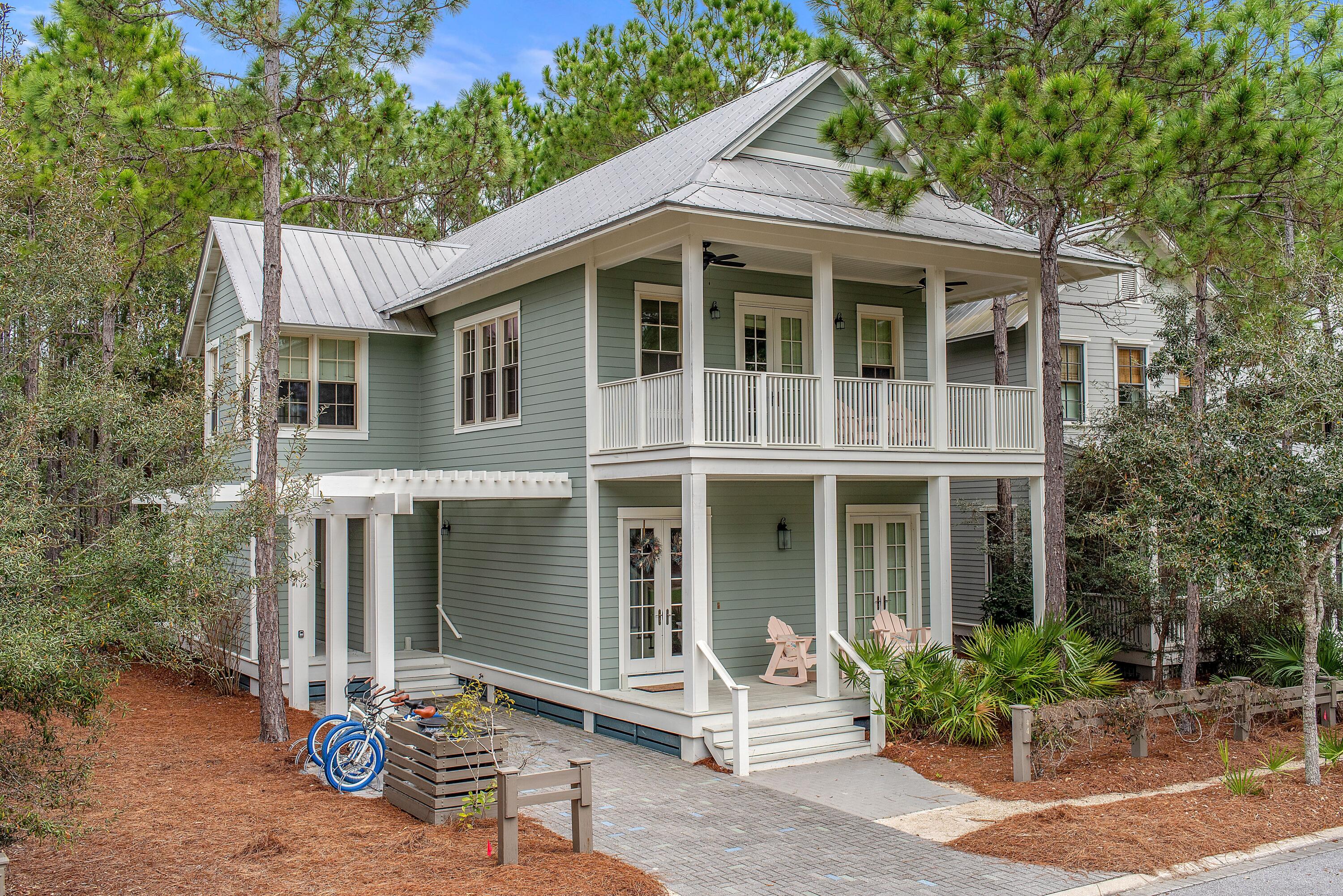 Sitting on a quiet side street this property features 4 bedrooms, 4.5 bathrooms with the beauty of a nature preserve in the backyard and one of Watercolors many parks and Camp WaterColor just steps out the front door this property will allow you to enjoy Watercolor living at its best! This Beachy property is adorned with white interiors and neutral wood accents, hardwood floors, coffered ceilings and an open floor plan on the first level make it the perfect space for entertaining guests and enjoying family time. The kitchen features black granite countertops accented with white cabinetry, and stainless-steel wolf and sub-zero appliances including a gas range. This home has the sought after first floor mini master bedroom with ensuite. The second floor offers the master bedroom an