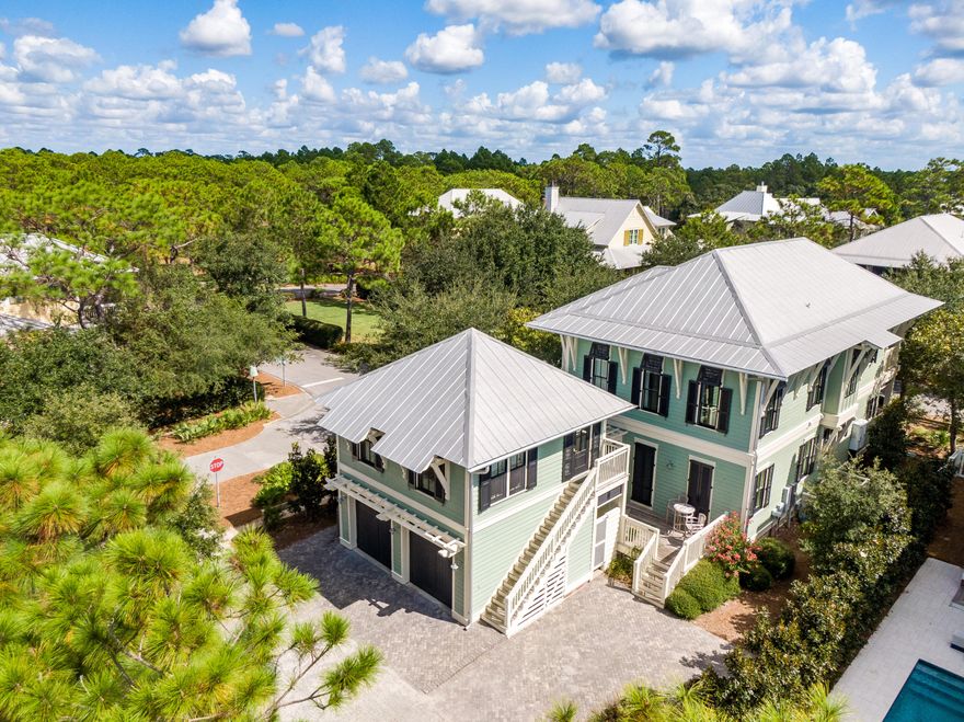 Placed perfectly on a corner lot across from a landscaped park in Watercolor is a shuttered New Orleans Style Home and Carriage House inviting you to come be a part of this quaint Beach Community. Warm, welcoming, and comfortable with casually furnished interiors and 2 floors of screened and wrap around porches this 5 Bedroom-5.5 Bath Home sold furnished can be the second home of your dreams and an excellent vacation rental. It is tucked on a quiet street providing privacy with a park on one side and common area space to the rear. The 2 car garage and a parking pad which accommodates 2 additional cars is more than adequate. The Open Floor Plan with porches everywhere invites friends and family to gather and enjoy all 3OA and our Beaches offer.