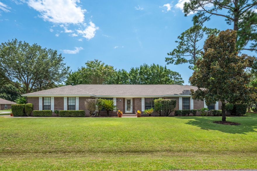 Located on the desired golf course community of Tiger Point on a large corner lot and offers an In-Law suite with separate entrance, open floor plan, sunroom and NEW ROOF (2020). You'll enjoy the new luxury vinyl flooring throughout the entire living area and many new updates throughout the home, such as all popcorn ceilings removed, all new hardware, carpet, and fresh paint throughout. The kitchen features beautiful granite countertops with a large breakfast bar, a mosaic tile backsplash, a pantry, a wall oven and 2 separate dining areas, including a breakfast nook and a formal dining room. The spacious living room has vaulted ceilings and a wood-burning fireplace. Just off the kitchen is an in-law suite or perfect potential for airbnb income. This is a true 4-bedroom home. Come entertain