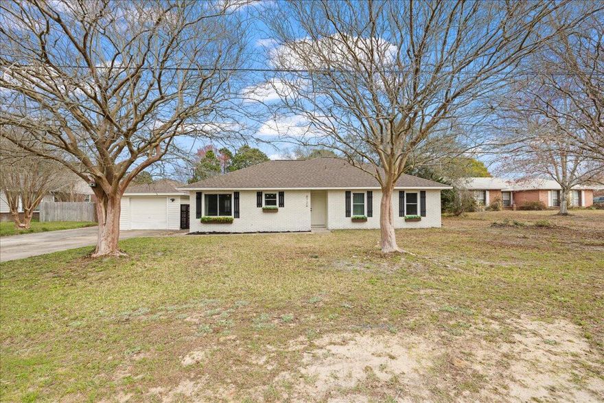 Big-ticket improvements are already done at 8724 Laredo Street - from the new roof to the new grinder pump -and the seller is offering $5,000 toward the buyer's closing costs.This thoughtfully updated 3-bedroom, 2-bath home blends everyday functionality with inviting design, featuring an open kitchen anchored by butcher block countertops, stainless steel appliances, subway tile backsplash, and updated lighting that adds warmth and character. Both the primary and guest bathrooms have been tastefully renovated, creating a fresh, cohesive feel throughout the home.Recent major improvements include a new roof, water heater, and grinder pump in 2024, along with an HVAC system replaced in 2019, offering valuable peace of mind for the next owner. An enclosed sunroom/laundry room provides additional flexible living space, while the detached garage creates room for storage, hobbies, or workshop use.

Set on a spacious lot just under half an acre, the backyard offers room to spread out, entertain, garden, or simply enjoy the privacy that larger parcels provide -- all without HOA restrictions.

Conveniently located near Navarre Beach, Navarre Beach Pier, and Hurlburt Field, this property offers an ideal balance of coastal access, everyday convenience, and move-in ready confidence. 