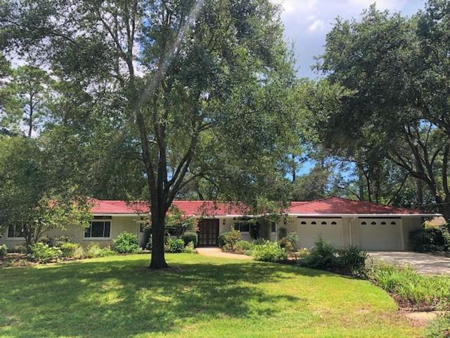 Welcome to Casablanca..Centrally located tucked away is this Beautiful Gem of a Home sitting on almost an acre. Features 4 bedrooms/3 bath with a TANDEM Garage & Workshop! An ALUMINUM ROOF, New Sprinkler system, New Windows and freshly painted. Kitchen has New Granite Countertops with a 12' Deep Sink. DOUBLE ENTRY Lead Glass Door welcomes you to this spacious home with overall 5,181 sq ft to include garage. Well maintained home, TILE flooring throughout exception 4th bedroom, Very Large Bedrooms & Closets. Looking for more space check into the Recreation Room and Florida Room which are heated & cooled. Step out to the FLAGSTONE Patio Area! You will love this Yard that is filled with beautiful blooms, mature live Oaks, Japanese Magnolia, Longleaf Pine and Dogwoods. Buyer to verify sq ft & all deemed important.