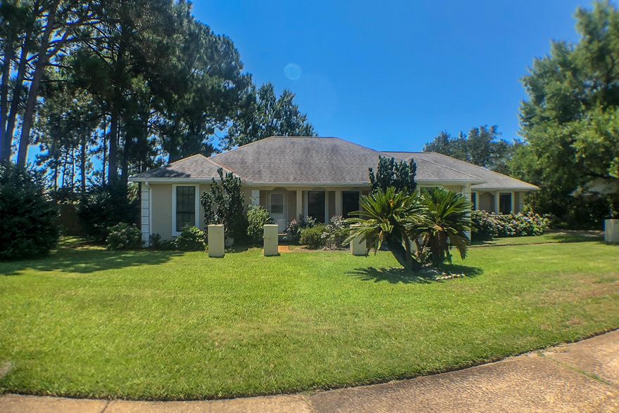 Beautiful freshly painted 3 bed, 2 bath home in Destin. Renovated with tile flooring in the main living areas, this stucco home is located in desirable Indian Bayou subdivision. The Master suite features a large walk-in closet, master bath has separate shower and garden tub, with his & hers vanities! Stainless steel appliances in the kitchen equipped with Lazy Susan in corner cabinets and undercabinet drop downs . Lots of built in cabinets throughout,in the laundry room, master bathroom and built in bar in the great room next to the fireplace! Amazing back yard privacy fenced in with mature citrus trees.Seller is offering a 10k flooring allowance!