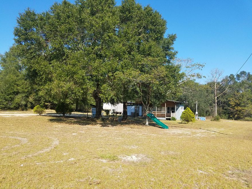 4+ Acres awaits your dream home. This parcel of land currently has a small 1 bedroom Mobile Home ( no value given ) that could be fixed up or tear it down and build your forever home. Peace and Quiet is what you will find when visiting this flat 4+ Acres.