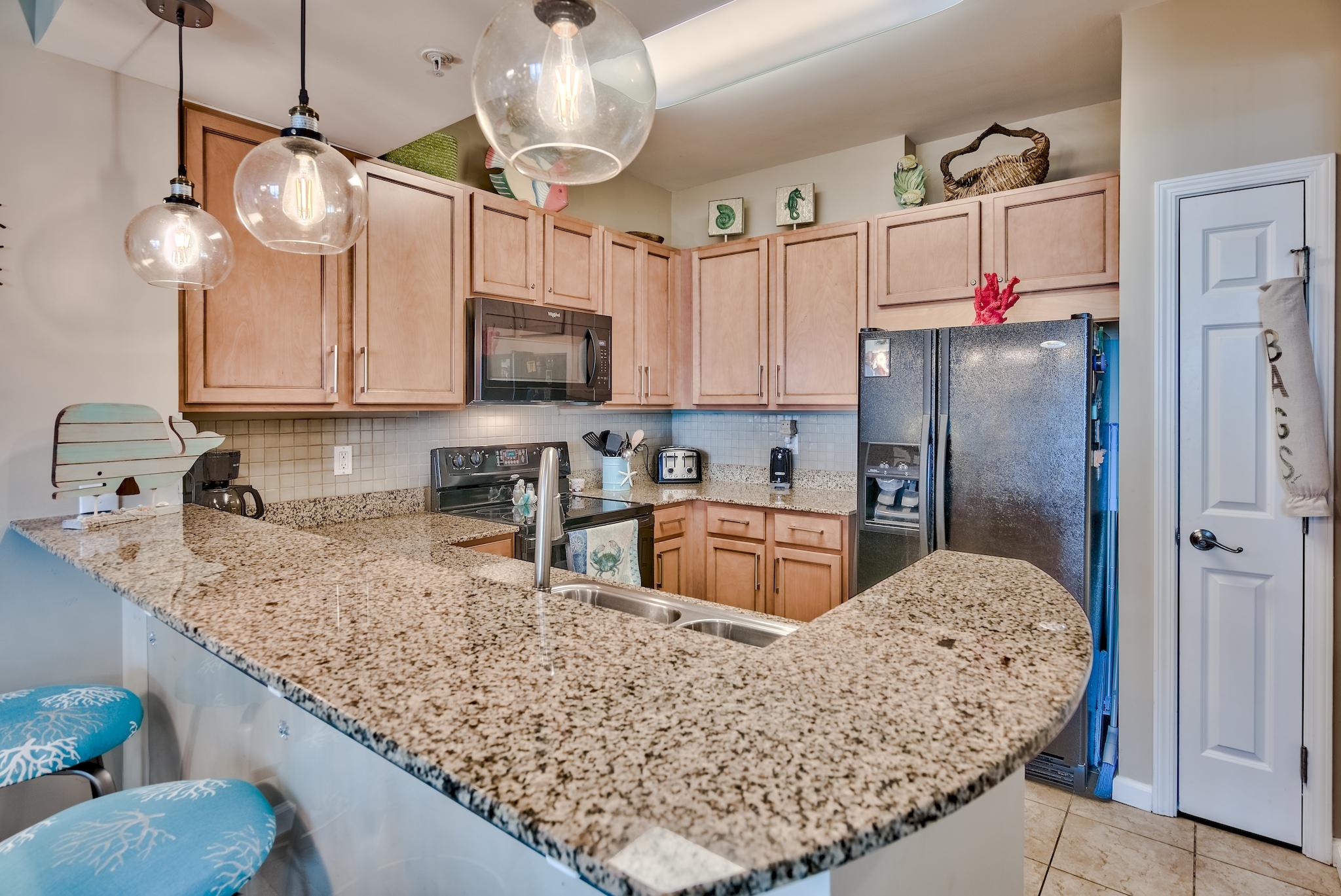 Are you looking for a unit with breathtaking views? Fabulous 2bdrm/2bath unit features stunning Resort and Gulf views. Unit comes mostly furnished and turn key ready! Kitchen boasts maple cabinetry, glass backsplash and granite countertops. The owners spared no expense with recent upgrades such as the pendant lighting over the breakfast bar and a new chandelier over the kitchen table! The open floor plan is perfect for entertaining. Second bedroom features a bunk bed plus a full size washer and dryer! Rental projections of $35k makes this an ideal investment or 2nd home.
