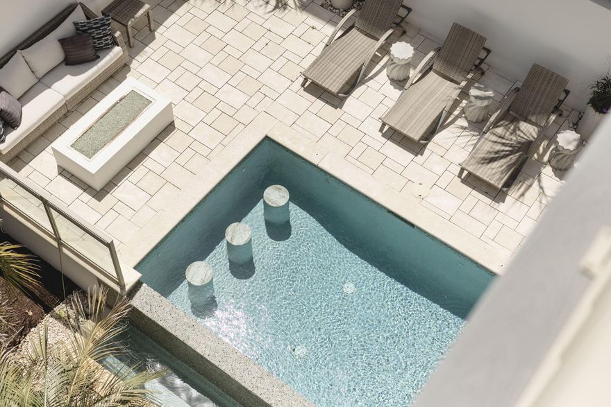 Reintroducing 124 Paradise by the Sea Blvd -- a masterpiece of coastal elegance, newly reimagined with a full-scale designer refurnishing that redefines luxury on 30A. Tucked behind the exclusive gates of Paradise by the Sea, this extraordinary 6-bedroom, 5.5-bath estate now marries architectural grandeur with elevated interiors curated for the most discerning buyer.Perfectly poised between the world-renowned communities of Rosemary Beach and Alys Beach, yet cocooned in complete privacy, this estate spans multiple levels of expansive living and entertaining space. From the moment you enter, every detail -- from bespoke furnishings and layered textures to coastal-inspired finishes -- speaks to effortless sophistication and relaxed grandeur.

Step onto one of the home's vast balconies and drink in breathtaking views of the emerald Gulf waters, or escape to your private pool and courtyard, a tranquil retreat surrounded by lush landscaping. A spacious yard offers plenty of room for outdoor gatherings, while your deeded beach access places the sugar-white sands just moments away.

Inside, an elevator connects all levels for ease and comfort, while the charming carriage house, connected by a breezeway, offers an inviting and fully furnished guest sanctuary, ideal for extended family or VIP guests.

This is more than a home, it's a lifestyle statement. All nestled within a guard-gated enclave with layers of security for peace of mind.

If you've been waiting for a turn-key, luxury coastal estate that seamlessly blends privacy, design, and walkability to everything 30A offers, this is it.