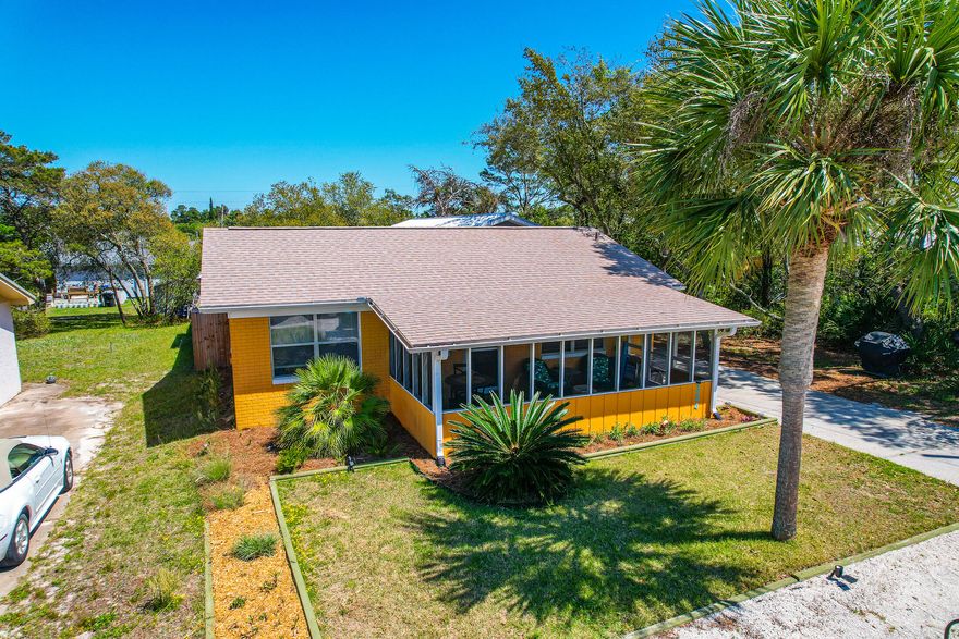 Absolutely adorable two bedroom beach bungalow with additional En Suite with bathroom in second building.   This is a turnkey investment property with amazing outdoor living space for entertaining family and friends after a great day at the beach!!  Rent out the main house and live in the En Suite or rent out both.  House AC 2016, WH 2021 and Roof 2020.  Second Bldg Built 2019 with new AC and InstaHot WH.  Located at the west end of Panama City Beach and conveniently located near Scenic 30A, Frank Brown Park, Pier Park and Lake Powell.   Be sure to check out the photos and videos; outdoor space is spectacular!!  Don't miss out on this one; it won't last long!  Call your agent today to schedule a showing.  This property is shown by appointment only.