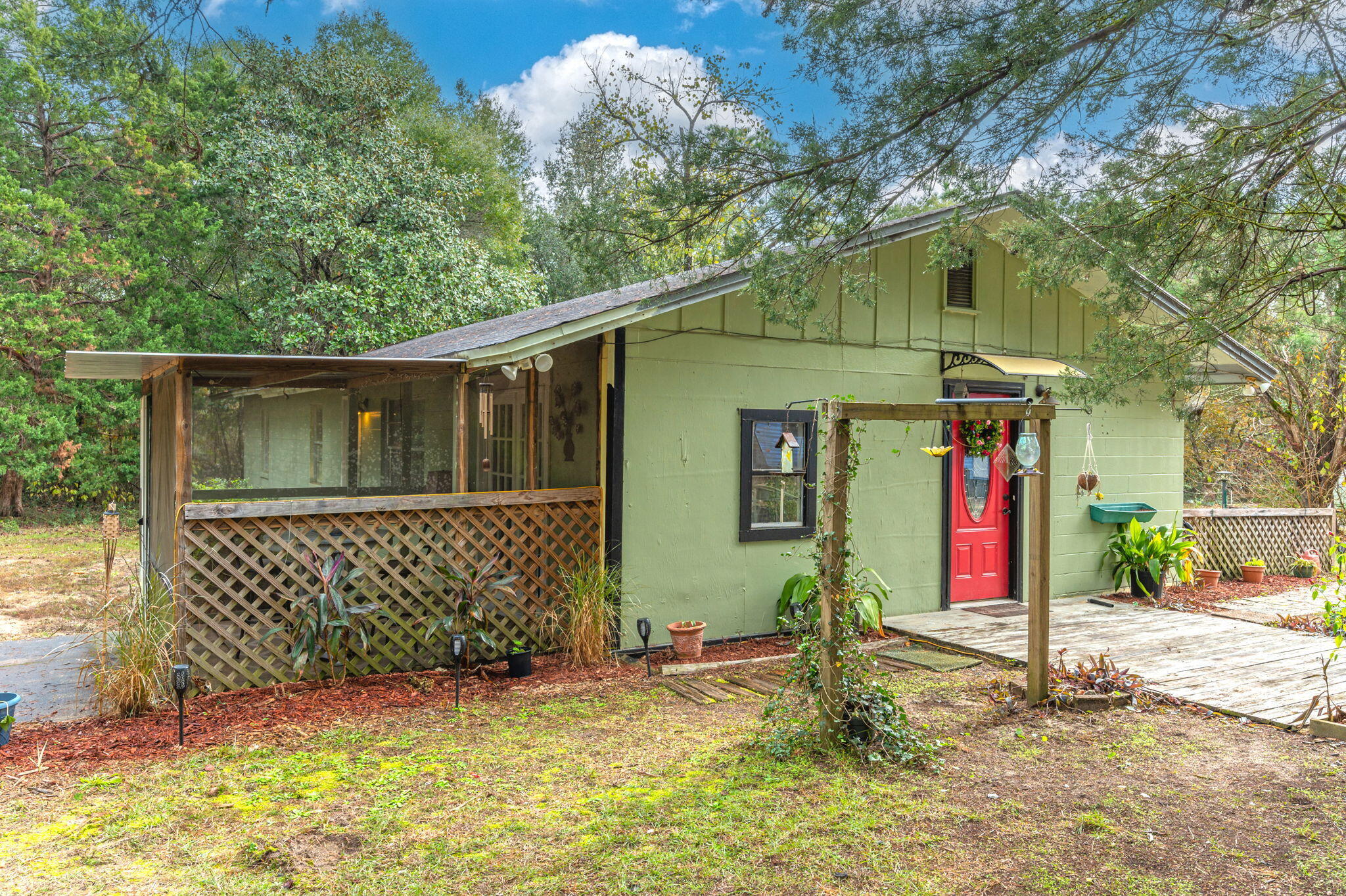 Nestled on a serene 1-acre lot in Mossy Head, FL, this charming 1,332 sq. ft. home offers 3 cozy bedrooms, 1 bath, and endless possibilities. With two utility sheds and a greenhouse, it's perfect for those seeking space for hobbies or gardening. Surrounded by nature yet conveniently located, this property is ideal for anyone looking to enjoy a peaceful lifestyle with room to grow. Don't miss this opportunity--schedule your showing today!