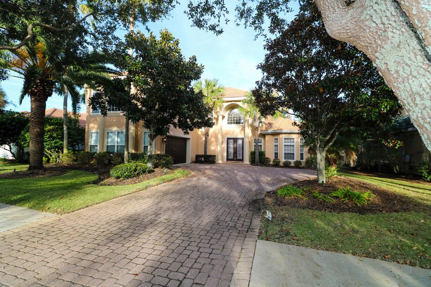 Motivated Seller!!! Bring Offers! Mediterranean style home located on the 10th hole in the gated golfing community of Regatta Bay. This home features high ceilings, built in shelving, surround sound, travertine floors & plantation shutters. The 1st floor master suite is located just off the living area. The kitchen features granite counter tops, gas stove top, sub zero custom cabinet side by side & an island with electricity. The 2nd floor features beautiful hard wood floors, an office & master suite that overlook the newly renovated gunite pool & screen enclosure. Guest quarters & another large game (media or bedroom) are also featured on the 2nd floor. Home is within walking distance to Regatta Bay Golf Club. Buyer to verify sq ft. Home sold ''As Is''. Seller to provide 1 year home war