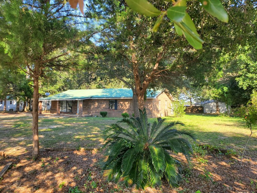 All brick home nestled in the heart of Crestview, very short distance to schools and shopping.  Great square footage on large lot just needs some love.  All appliances are missing and room additions need completing. Large Bonus Room can be second master bedroom.  Window unit AC and no heat.   Being sold AS IS.  Buyer to verify square footage.