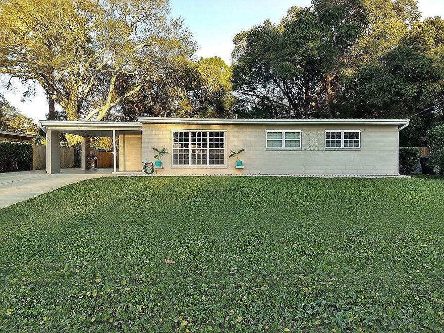 Charming 3 bed, 1.5 bath Florida block home with 300+ sqft 1-bedroom, 1-bathroom guest house. Open floorplan  w/tile throughout. Lg window in living rm provides ample natural light. Updated kitchen features a bar, soft-close cabinets, Whirlpool stainless appliances, under-cabinet lighting, & gas range. Beautiful, spacious deck great for entertaining/relaxing. Deck has sink, gas hookup for a grill, TV mounting/hook up, surround sound, recessed/dimmable lighting. Ceiling fans in two of the bedrms & the guest house. Newer windows double-pane vinyl w/fitted hurricane shutters. Tankless Rinnai gas water heater provides unlimited hot water & reduces energy bill. 3-Zone irrigation system w/well. Extra parking w/space for a boat, camper, or trailer. Plenty of storage in the 10 x 8 shed, covered