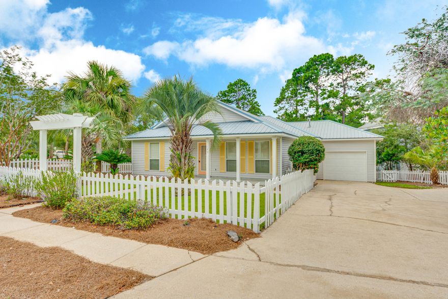 Beautiful 3 bedroom 2 bath beach style home in desirable community. Close to beach, shopping, and more! Large entry, open living dining combo, breakfast bar, fireplace and roomy kitchen. Large windows fill the main living space, allowing lots of lighting. One car garage, large wrap around back porch, and beautiful yard with inviting landscaping. This move-in ready home is priced low and won't last long. Vacant and easy to show.