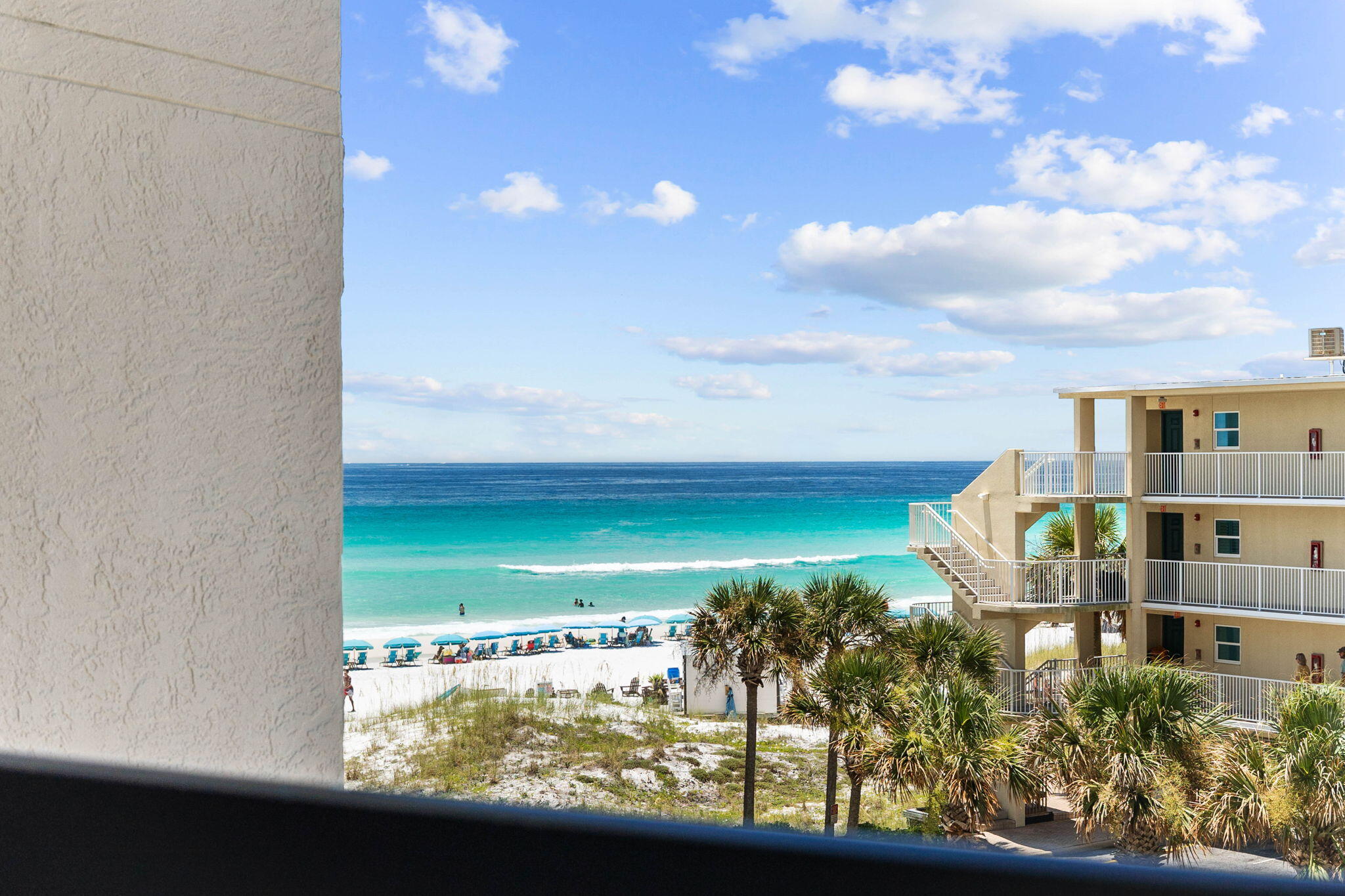 Welcome to the SunDestin resort community, where this one-bed, one-and-a-half-bath unit offers gulf-front living at its very best. Right on the sand in the heart of Destin, this fourth-floor condo has an open floor plan with tile floors giving way to carpet in the bedroom. Surprisingly spacious, this cozy beach retreat can sleep six in a king-size bedroom with a pull-down double wall bed and a queen-size sleeper sofa in the living room. A full bathroom and an additional half bath ensure a civilized start to the day. The C-shaped kitchen has modern white cabinets, granite countertops, bar seating and a full range of stainless steel appliances. Fix yourself a long fruity drink and take the party outdoors onto the newly tiled balcony. It's a private place to relax and enjoy stunning sunsets and gulf views at the end of each day. The sitting area has a sofa, TV, and a mirrored wall for added light, while the spacious dining area includes a Murphy bed, neatly stowed away in its own cabinet. Clean and well-presented, this condo had new HVAC in 2022, along with a new tub/shower combo in the main bathroom. This well-located vacation retreat has parking for two vehicles. The community has excellent amenities, including an indoor and an outdoor pool with a sun terrace, making this a year-round destination. It also has an elevator, on-site bar and restaurant, hot tub, sauna, spa and fitness center, splash pad for little guests, shuffleboard and a gift shop. Services include massage therapy, a game room and a conference center for meetings. There's also a convenient beach service for renting chairs and umbrellas, so there's no need to haul your beach chair to the sand. Centrally located close to Destin Commons for shopping and dining, this condo is a great investment with rental projections of $40,000 to $50,000 per year.