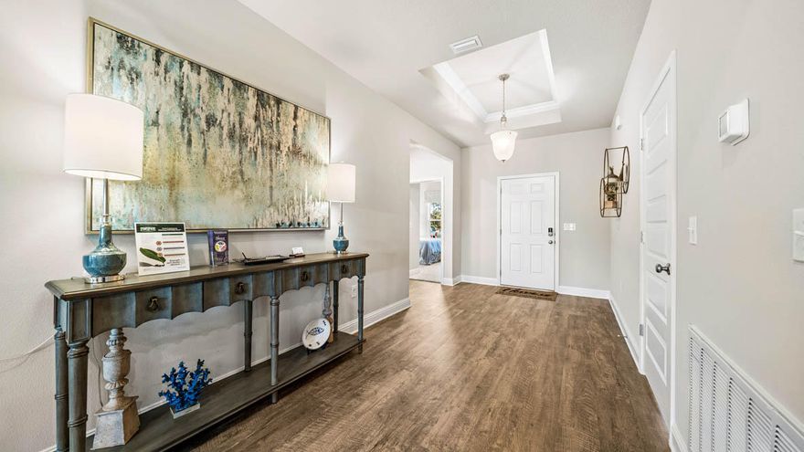 The Hawthorne plan is a 4 bed, 3 bath, 3 car garage home located in Hammock Oak Estates!  This gorgeous home has a spacious laundry room with a huge storage closet just off the garage. Three guest bedrooms are towards the front of the home as well as two guest bathrooms. A large living space is open to the kitchen and dining area which overlooks the back porch. The kitchen has granite countertops and Whirlpool stainless steel appliances. Bedroom 1 is towards the back of the home and has an exterior door connecting to the large covered porch. Bedroom 1 also features 2 walk-in closets and a bath that has a free-standing tub, a shower, water closet, and dual vanity sinks.