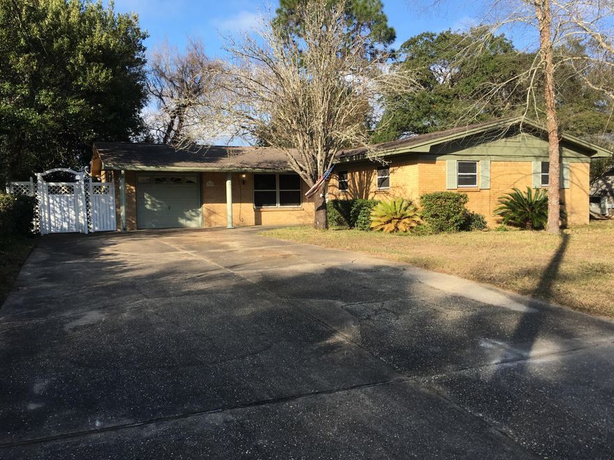 Owner Financing now considered for qualified buyers. All parquet wood flooring removed! Brick home, three bedroom-two full baths, covered back porch and large fenced back yard. Great fixer-upper for primary residence or investors. Close to schools, shopping, military bases, and just a short 5 mile drive to the most beautiful beaches in the world. All Information recorded in the MLS is intended to be accurate but cannot be guaranteed, buyer advised to verify. Sold As-Is.