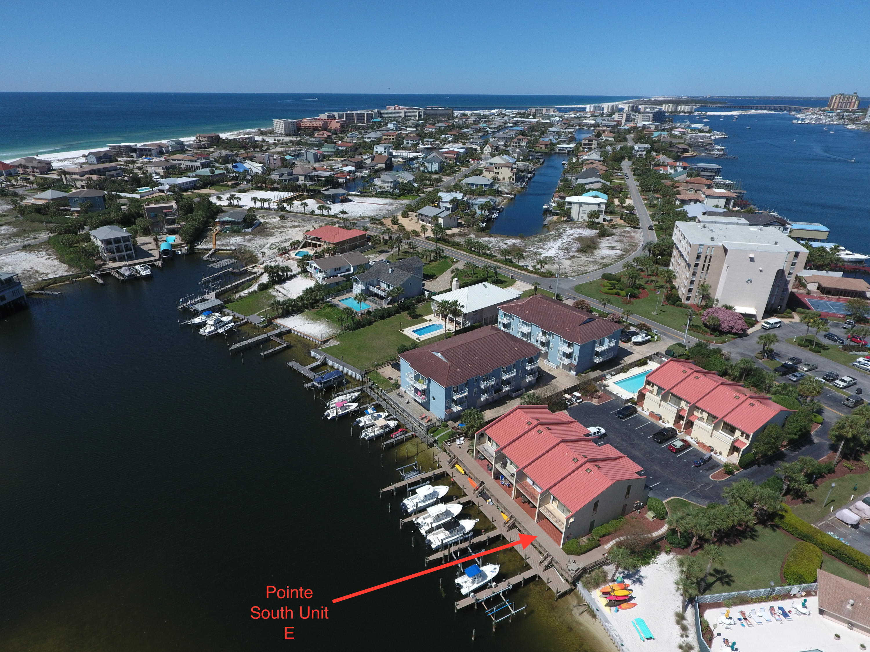 Fully renovated, absolutely gorgeous END UNIT at Pointe South Townhomes has one of the most beautiful harbor views in Destin! This unit also comes with it's own assigned BOAT SLIP, slip 8 which is the END SLIP right in front of the unit. Pointe South is a quiet, 8 unit complex that lies at the Eastern end of the spectacular Destin harbor that features a community pool and is 3 blocks to the beach! The panoramic views from the first and second floors are simply stunning. Recent renovations to this unit include wall to wall travertine tile downstairs, as well as the upstairs baths and master shower. Granite counters are featured throughout. The gorgeous kitchen offers stainless steel appliances and all new cabinetry as well. The master bedroom offers an attractive vaulted ceiling and lots of natural light from the expansive windows. The unit was just painted from top to bottom, and the HVAC system is new! There are built-in storm shutters on the water side of the unit, as well as two assigned parking spaces and plenty of storage with a large storage/work shop right outside your front door. The large boat slip (11 ft. width between pilings, boat lift width: 8 ft. 5 in.) can easily hold a 30 foot vessel! The Destin Water Taxi is a phone call away and can pick you up on your own boat dock and take you to any of the fantastic restaurants along the harbor! Pointe South is truly one of the best spots for enjoying the Destin harbor lifestyle. Come see for yourself! The HOA fees cover shared budgeted exterior insurance, landscaping, and pool maintenance. Buyer is to please verify all information to their satisfaction.