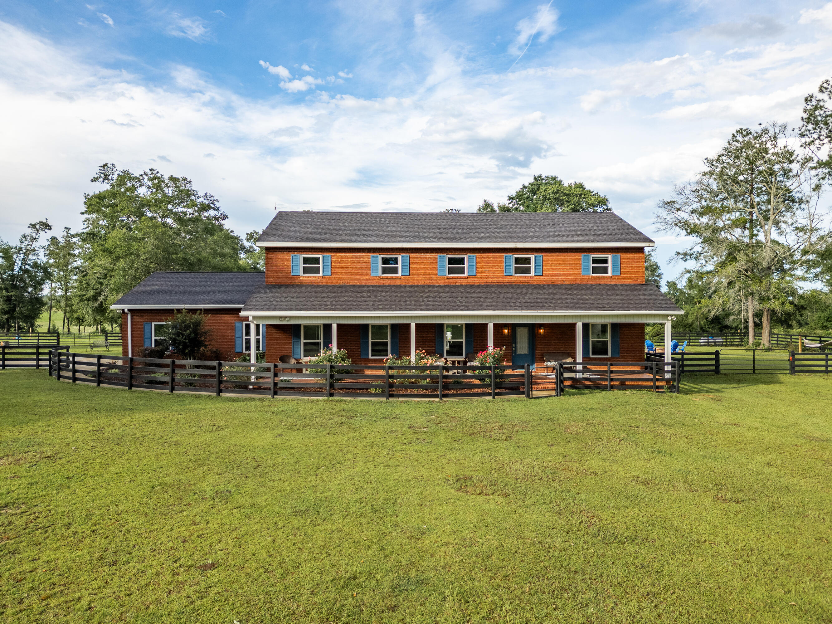 Discover country living at its finest a- This expansive 10-acre property offers a fully remodeled 3,340 sq ft main home PLUS an 850 sq ft guest house with plenty of space to relax and entertain. 7 bedrooms, 3.5 baths and an office in main home. Cool off in the sparkling pool, wind down in the hot tub or enjoy the peaceful surroundings from your back porch. Equestrian and farm-ready, the property features a large barn with kitchen/office and bath and has animal stalls, a separate pole barn, and fenced pastures. The 2 bed, 1 bath guest home is perfect for extended family, guests, or rental income. It offers add privacy with its own entrance and address as well. With room to roam and everything you need for a rural lifestyle, this property is a rare find. Schedule your private tour today!