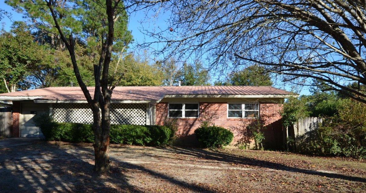 This conveniently located REO home is minutes from schools, churches, city amenities and more. Built in 1965, this all brick home has 1 car garage and metal roof. Lots of room inside with 3 bedrooms and 1 and a half baths as well as large bonus room with fireplace. Though there is an inground pool at this property, pool is not operational at this time. A must see to appreciate. Call today!
