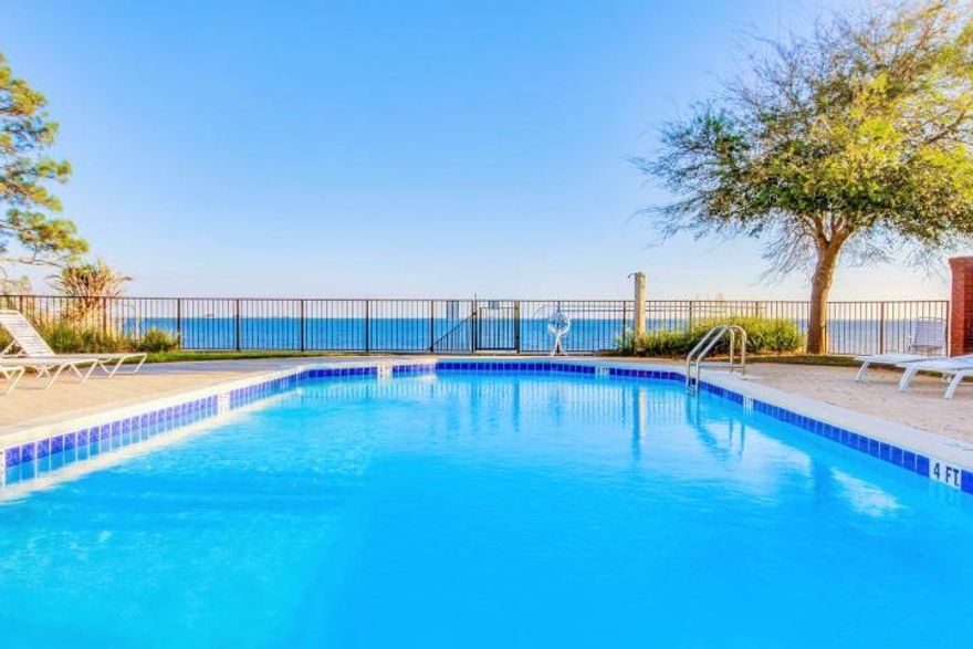 RARE WATERVIEW LOT!! THIS IS THE LAST LOT AVAILABLE CLOSEST TO THE WATER FOR SALE ...READY TO BUILD YOUR DREAM HOME!! .Located in the prestigious waterfront community of Heritage Park. Convenient to Navarre Beach and Military bases. The community features a well equipped clubhouse, nice Gym, and a beautiful swimming pool which sits on an eighty foot waterfront access lot for the homeowners. Community also offers underground utilities, sidewalks and Private gated entrance!