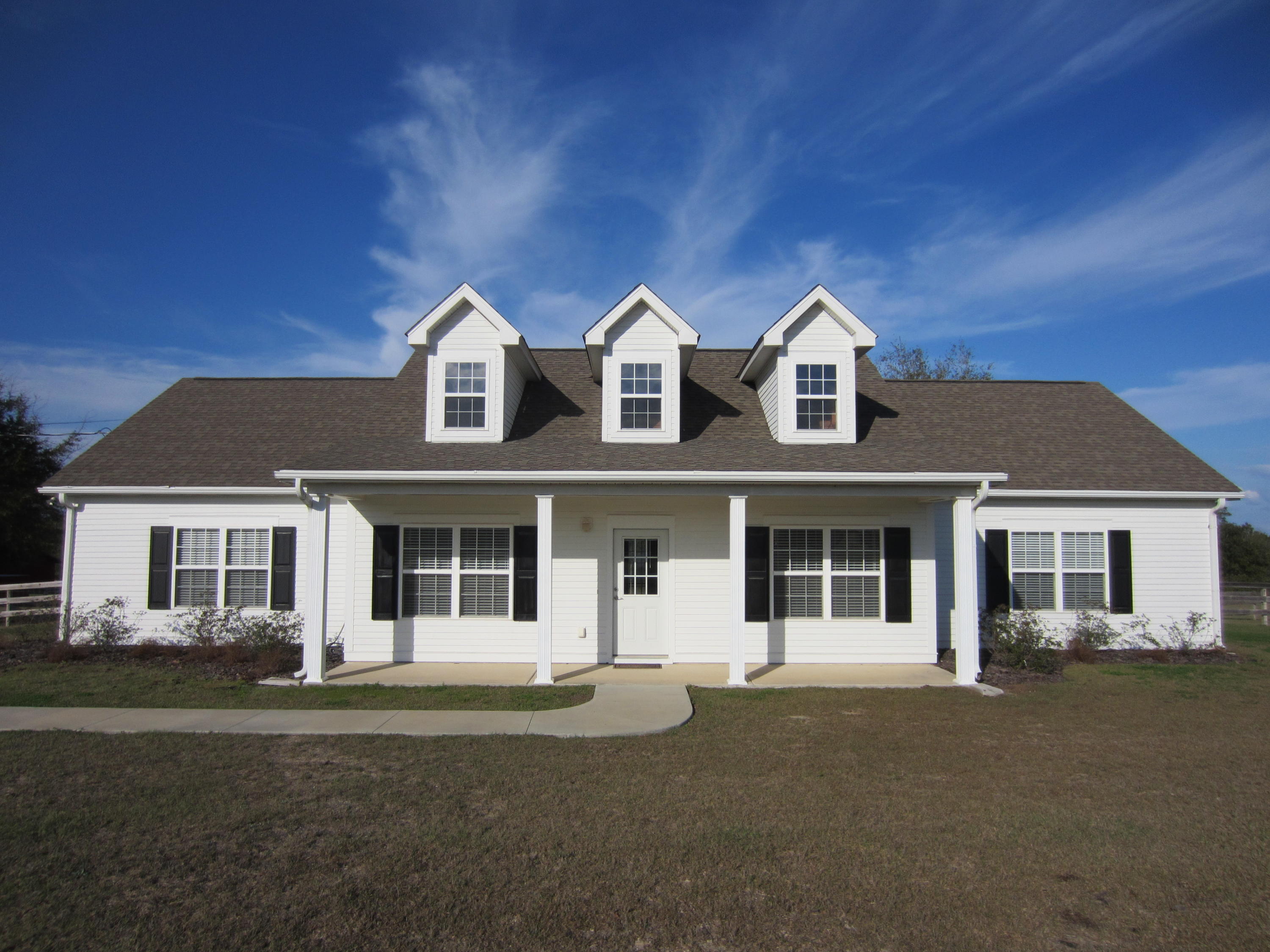 4 Lrg BR, 3 Full Bath, 35.2 Acres in Excellent move in ready condition. Since purchasing in 2015 current owner has completely fenced entire cleared area, + fenced in a ''Back Yard'' for his small dogs. Installed a sprinkler system for front & back yards / had concrete driveway laid vs dirt drive / had original vinyl siding on the house replaced with ''HardiePlank'' (fiber cement siding) / completely painted inside & outside / new Maytag washer & dryer (Maytag Stainless Steel kitchen appliances) / trees planted in front yard / cleared pasture land all very well maintained. The 36'x36' barn with stalls has water and electric. Plus hay or animal lean-to. Open plan living, dining & kitchen with breakfast bar. Split Bedroom Plan: very large Mstr BR + 2 large walkin closets + large Bathroom