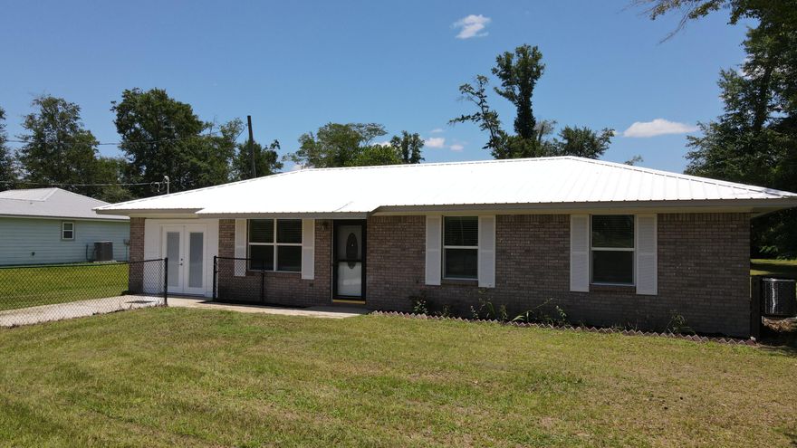 Step into this beautifully renovated 3-bedroom, all-brick ranch, perfectly situated on nearly half an acre. From the moment you arrive, you'll appreciate the fenced front yard, spacious 2-car garage/workshop out back, and the fresh, like-new feel throughout.At the heart of the home is a stunning new kitchen featuring custom cabinetry, granite countertops, and brand-new stainless steel appliances. The interior has been freshly painted, and a bonus room was added to the heated and cooled living space when the new HVAC system was installed. Additional upgrades include new windows, a new roof, a new water heater, updated flooring in the bonus room, new French doors, handicap-accessible toilets, and a brand-new well bladder offering both comfort and peace of mind. With most everything updated throughout, this home feels like new! Located just 10 minutes from the new Publix on Hwy 231 and only 40 minutes from the pristine beaches of the Emerald Coast, this home is the perfect blend of convenience and charmmove-in ready and waiting for you!