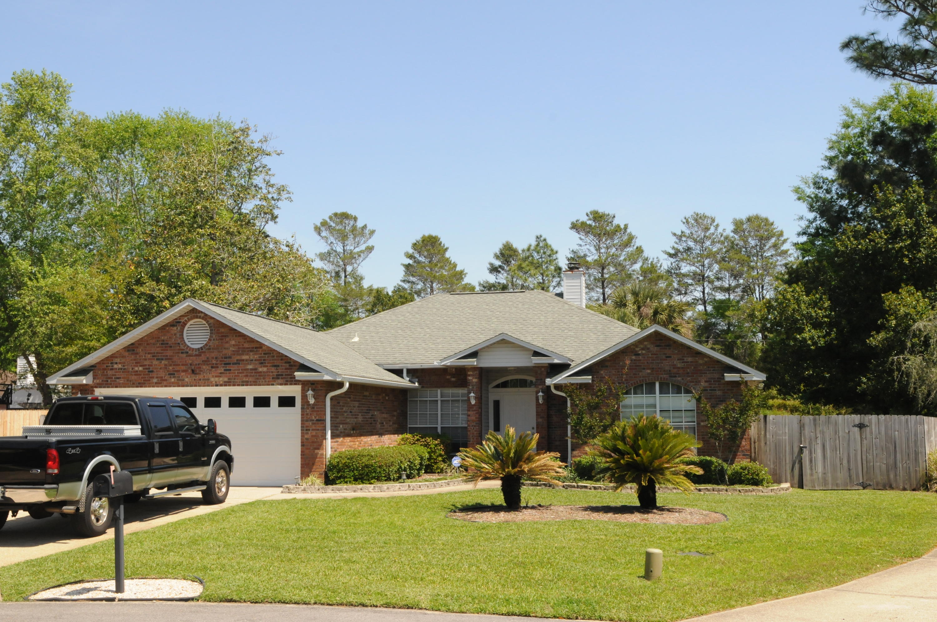 Rocky Bayou Country Club Estates lives LARGE- This pool home sits on a quiet cut-de-sac. Kitchen with skylight and newer stainless steel dishwasher and fridge, built in desk, extra cabinets and bookcase. The large breakfast nook overlooks the pool area from a bay window. New pool heater, updated Spa, pool cage for easy maintenance and maximum enjoyment of the pool. This .33 acre lot has plenty of yard space for additional family activities. A large fenced back yard also provides extra-wide gate access to a large gravel parking pad for your camper, boat, or other toys. Large master suite opens to the screened porch and pool area. Master bath includes dual vanity, whirlpool tub, separate shower and 2 closets including walk in. No carpet in the home, generous 2nd and 3rd bedrooms-Call today