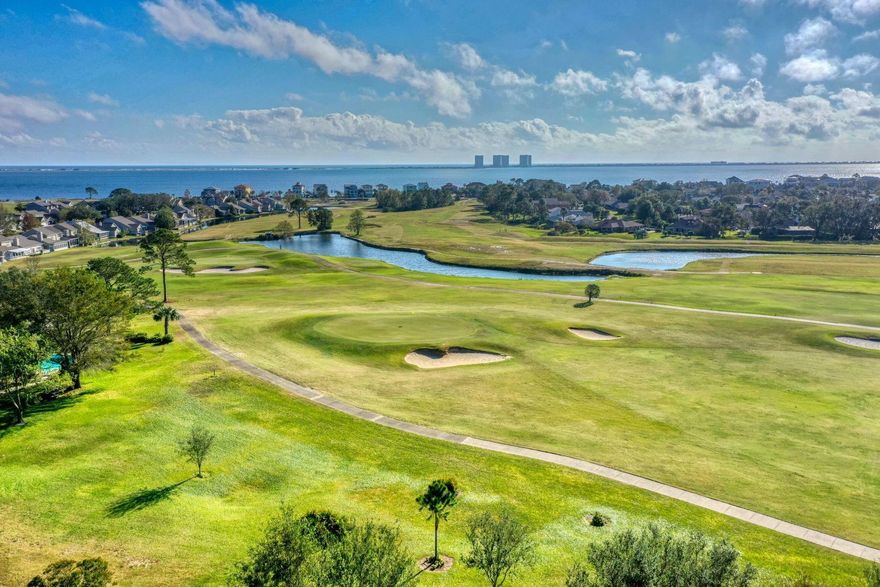 Lovely family home in highly sought after Tiger Point!  Step up to the huge, covered wrap around front porch into a 4 bedroom, 2 bath home.  Inside you are immediately greeted by a large foyer and family room with wood burning fireplace. Recently remodeled eat in kitchen with stainless steel appliances, quartz countertops, tile backsplash and farmhouse sink.  Separate formal dining room and laundry room.  Open and airy bedrooms with 9' ceilings.  Master bedroom with double vanities, double shower heads and his and hers walk in closets!  Climate controlled sunroom overlooking a large fully fenced yard truly make this home perfect for a family!  Roof 2006; HVAC 2018; Water Heater 2016.