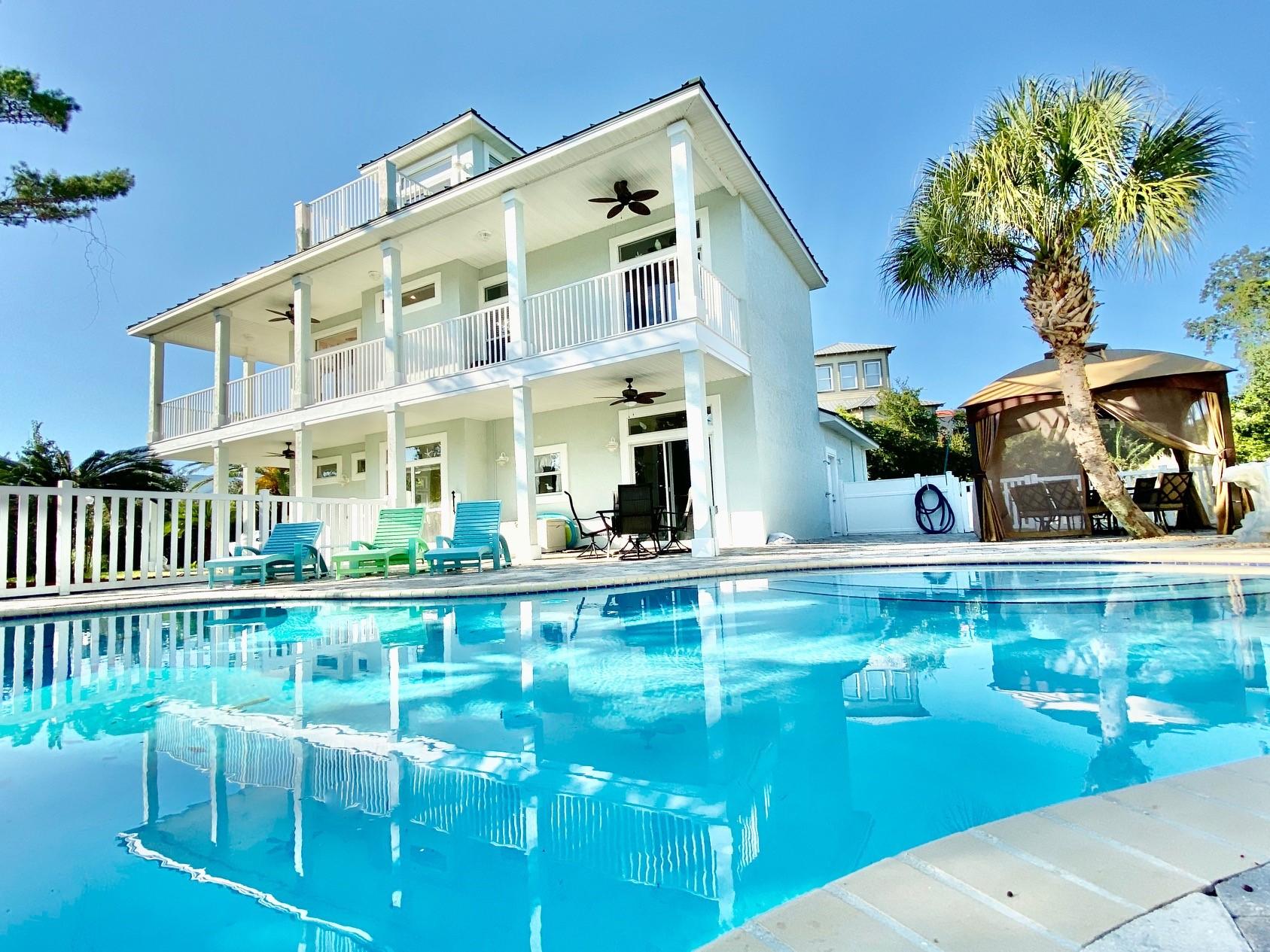 **One of the largest lots on 30A** Steps to Gated Beach Access** The Huge Pool and spacious Paver Pool Deck create a perfect oasis for outdoor entertaining. Boasting a 2 car garage this home offers plenty of storage and room to expand. The homes's interior features include 3 Bedrooms and 3 Full Baths, tile flooring on 1st level, hardwood flooring on upper floors, Each Bedroom has Beautiful Southern Views facing pool deck and Gulf of Mexico.