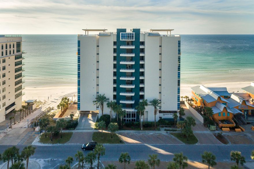 Located on the sand in the heart of Destin, Florida at beautiful Signature Beach Condominiums, this furnished exquisite 4 bedroom 4 bathroom retreat is perfect for full time living or a second home. This exclusive property offers a private beach and rooftop infinity pool and is a gated, non-vacation rental building. Upon entering, you'll note the stunning panoramic Gulf views with 10 ft floor to ceiling windows encompassing the entire living area. The massive 300 square foot covered balcony shines as an extension of your living space where you can sit back and enjoy a cool beverage while watching the sun set over the Gulf of Mexico. Featuring an open floor plan, this unit provides ample entertaining space and a spacious living area. The gourmet kitchen boasts of beautiful granite counterto
