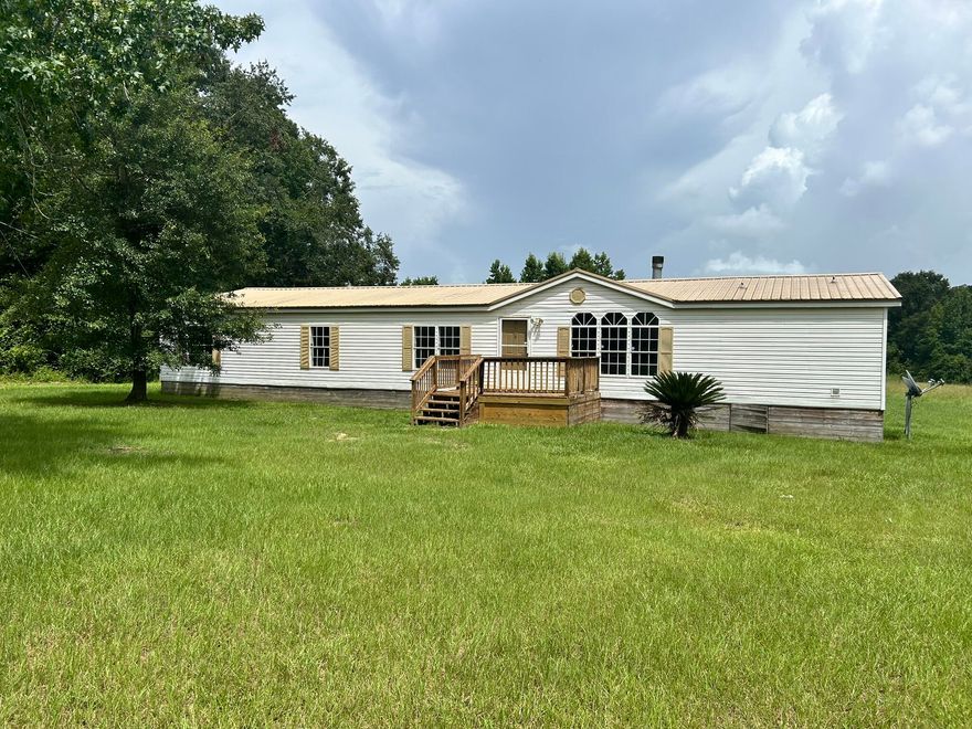 BRING YOUR FARM ANIMALS! Outside farm animals welcome. If you have horses and need more acreage we can add more. Huge 5 bedroom two bath manufactured home with garden tub Fireplace, Huge living room, dining room and Kitchen. Brand new LVP flooring throughout!  Disclosure Listing agent has ownership interest.