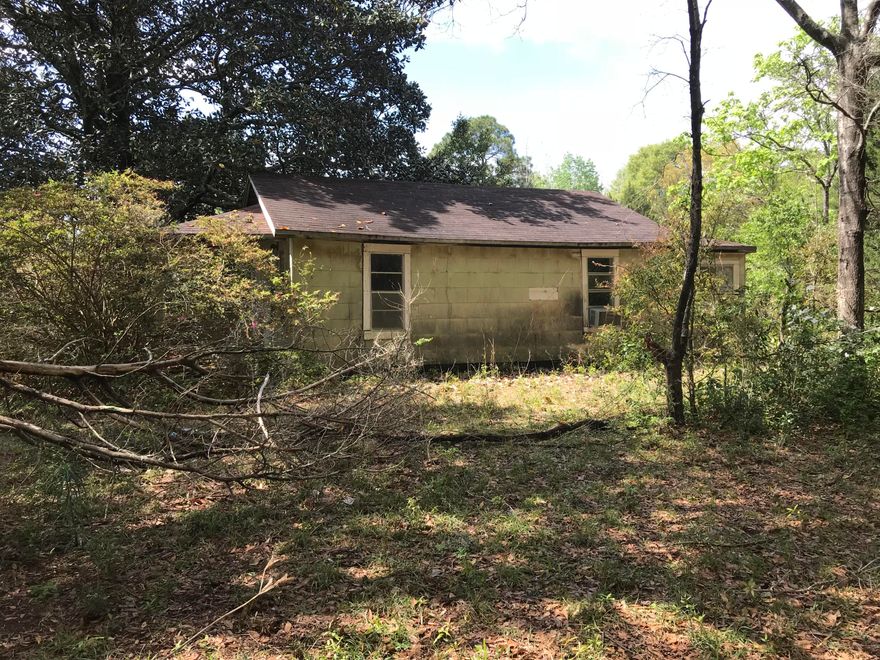 This 2.66 acre plot has an old home on it with no value. There is acreage available next door. The zoning is rural village, which allows some commercial activity. DeFuniak Springs is re-inventing itself. You may one day regret not buying this parcel at the low asking price.