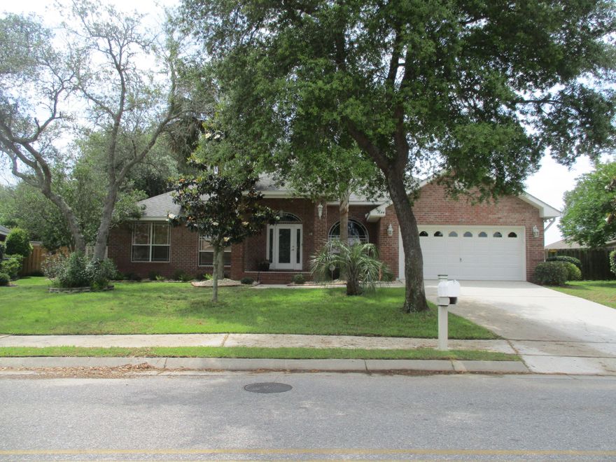 Owner is offering a 1 year Home Warranty with First American Home Warranty Corp. Beautiful 4 Bedroom 3 Bath Brick Home is The Entertainers Dream Complete with Screen Enclosed Heated Pool&,Florida Room, Large Eat in Kitchen with built in Desk/Serving area & Den. Perfect for all Your Gatherings.The Kitchen has Upgraded Stainless Steel Appliances including a Professional Viking Gas Cook top, Double Electric Wall Oven, Tile Backsplash, Granite Counter tops and Breakfast Bar. The Great Room sports a Gas Fireplace and Cathedral ceilings. The 4th bedroom has its own Bath and Private Entrance that exits to the pool area and back yard providing easy access to shower.