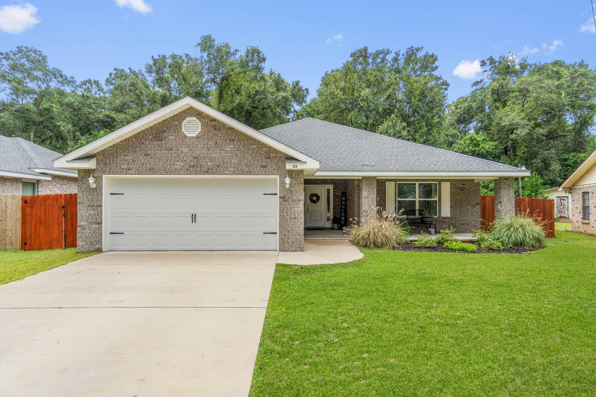 Welcome to this beautiful 2022 all-brick home in Pensacola!This 3-bedroom, 2-bathroom home offers a split-bedroom, open-concept layout that works well for both everyday living and entertaining.The living room is a comfortable gathering space with a triple trey ceiling and crown molding -- a feature you'll also find in the primary suite. Durable LVP flooring flows through the main living areas, keeping things easy to maintain while still looking great.In the kitchen, you'll find stainless steel appliances, plenty of cabinet storage, and a bright breakfast nook that can double as a cozy reading spot.Step outside and enjoy the fully fenced backyard, freshly stained for a clean look. Two orange trees and a lime tree add a little homegrown flavor, while the covered back porch is perfect for relaxing evenings or weekend get-togethers. The hot tub stays, so you can start unwinding from day one.
For extra convenience, the washer, dryer, and a garage deep freezer are all included - making this home truly move-in ready.