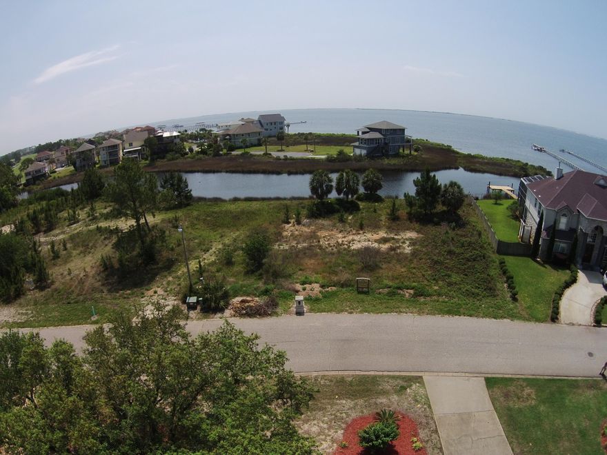 171 feet of WATERFRONT on this LARGE .43 Acre lot ready for building in Tiger Point! Across the street from the Golf Course hoe #5 the Island Green with expansive views of Santa Rosa Sound. Close to Garcon Bridge for easy access to Interstate 10 and Pensacola. Wonderful neighborhood to raise a family.