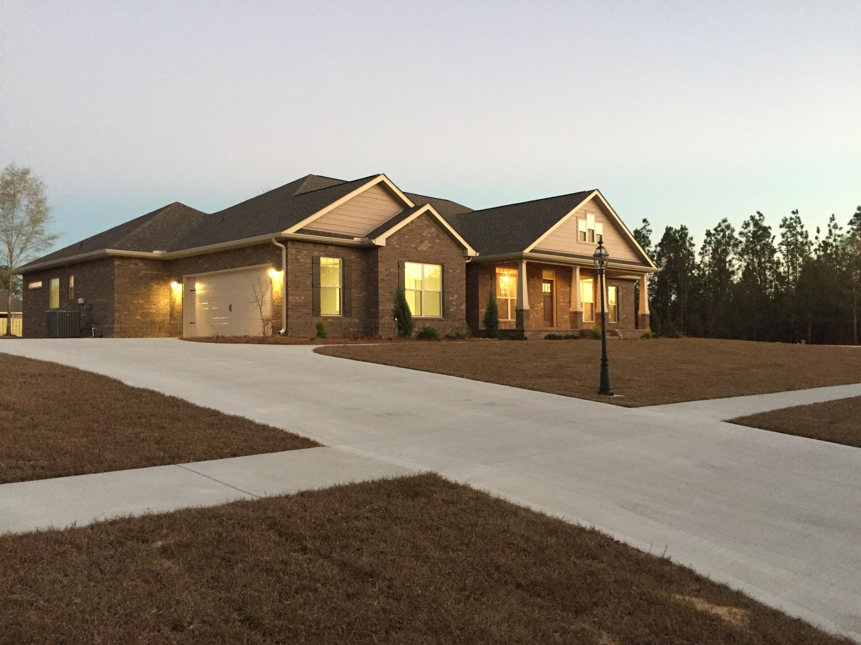 Gated Community, Award Winning Builder, Huge .70 Acre Lot, Convenient location and the most incredible floor plan! Includes additional 2 car detached garage upgrade,4 car total! This Open concept 4 bd 3 full bath home features a formal dining room with rustic wood accent wall w/sconce lighting, hardwood floors, HUGE Kitchen with white cabinetry, stainless farmhouse sink, huge island witch painted exposed brick back, granite tops throughout, an HUGE walk in Butler's pantry, stainless appliances, glass tile back splash, large breakfast nook and a brick fireplace surround. The master suite features tons of space ,Huge walk in tile shower with glass tile accents, double vanities, soaker tub, huge walk in closet and direct access to laundry/Mud room with built in bench drop zone. Large bedrooms