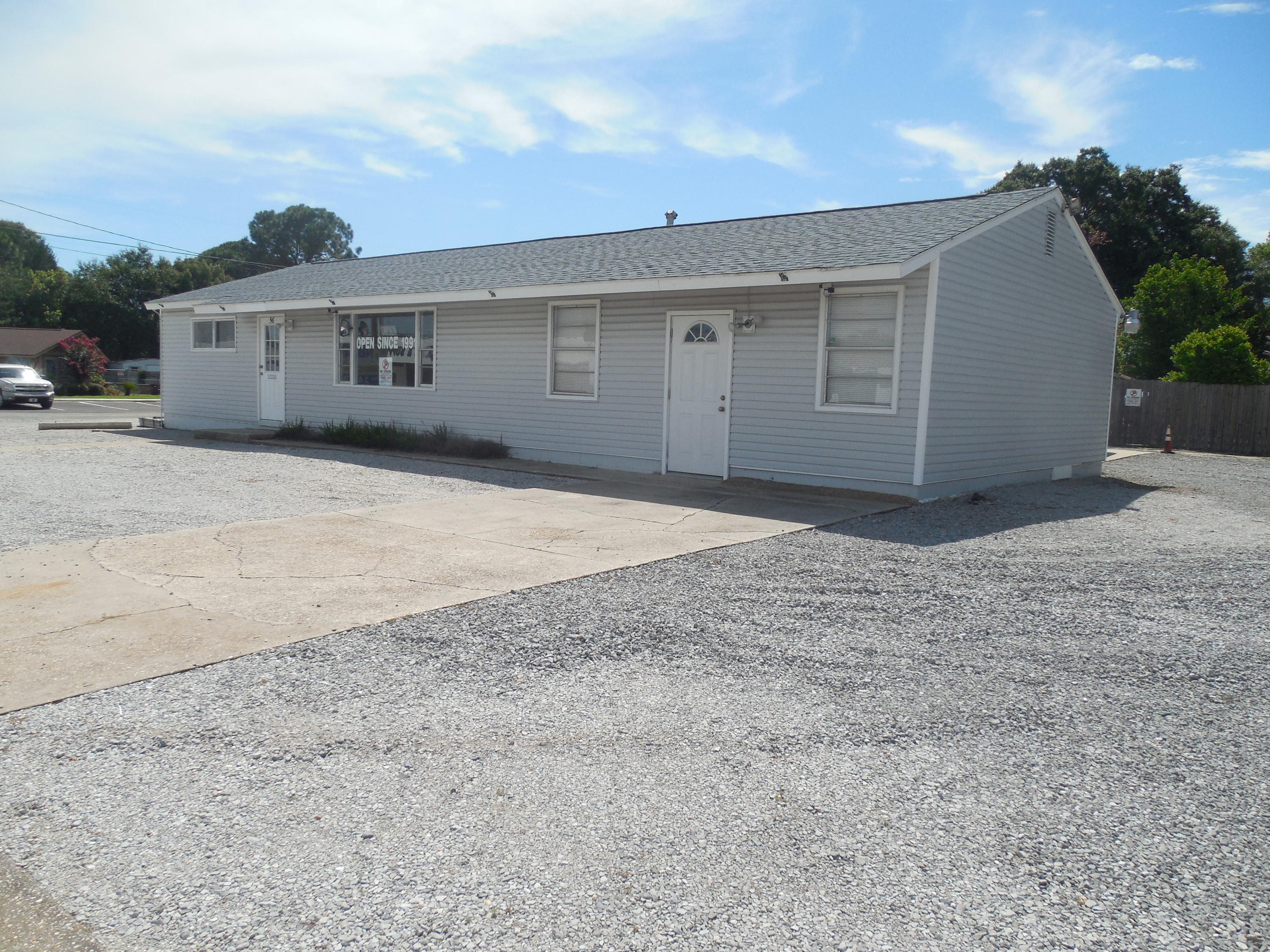 Location! Location! Highly visible commercial property located in the heart of FWB on Beal Pkway. Great traffic count & excellant opportunity to own than lease. Plenty of parking with covered parking in back. The value of this commercial property is in the land with some value/bonus of a building. This 1,440 SF building (previously renovated home has reception rm, 3 offices, bathroom, mail room, kitchen with sink & refrigerator, & a lg storage room. This building has AC window units. Sold AS-IS.