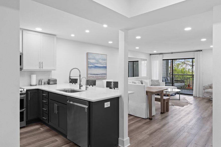 Step into a world of boundless inspiration at 8980 Heron Walk Drive, a breathtaking 2-bedroom, 2-bathroom bay-front condo, exquisitely renovated inside and out, where coastal elegance meets modern luxury in the heart of the prestigious Sandestin Golf and Beach Resort. Whether you envision a lucrative rental investment or a life where every day feels like a vacation, this home welcomes you with a wave of serenity, carried by a radiant, open-concept floor plan drenched in natural light. The seamless flow of the kitchen, dining, and living spaces opens to a covered lanai, where awe-inspiring views and vibrant seasonal sunsets invite you to pause and dream.Every detail radiates sophistication, from the sleek luxury plank flooring to the contemporary lighting and tranquil coastal hues that envelop the space in warmth and elegance.

The fully reimagined kitchen, a true masterpiece, sparkles with gleaming quartz countertops, premium stainless steel appliances, and bespoke cabinetry offering abundant storage and counter spacedesigned to ignite culinary creativity and foster unforgettable gatherings. Discover the cleverly concealed laundry appliances, a thoughtful touch that enhances both form and function.

Experience a symphony of elevated enhancements crafted to enrich your lifestyle, including a screened-in lanai for serene evenings, a chic wine bar with a dedicated refrigerator, whisper-quiet ceiling fans, soft-close cabinet hinges, and an advanced water filtration system. This state-of-the-art technology purifies water while preserving essential minerals, delivering a crisp, naturally balanced taste that elevates every sip.

Retreat to the generously appointed bedrooms, where the primary suite becomes your personal sanctuary, framed by mesmerizing water views, blackout curtains for restful slumber, a spacious closet, elevated bath fixtures, and a luxurious walk-in shower that redefines relaxation.

The equally refined second bedroom and guest bath offer a warm embrace for family or guests, with elegant plantation shutters and direct bath access ensuring comfort and privacy.

Beyond its elevated interior and meticulously improved exterior, this home transforms your lifestyle with a rare designated golf cart parking space and charging station, perfectly suited to the resort's vibrant, golf cart-friendly community. You're just a 1.1 mile golf cart ride from the beach, and can even take your golf cart grocery shopping, to dining and recreation through the community. 

Fully furnished and move-in ready, more than a homeit's a portal to a life of unparalleled luxury, leisure, and cherished moments along the Emerald Coast.

Professional photos are coming soon, but the vision of your extraordinary future begins now. Dare to embrace a life inspiredyour coastal masterpiece awaits!