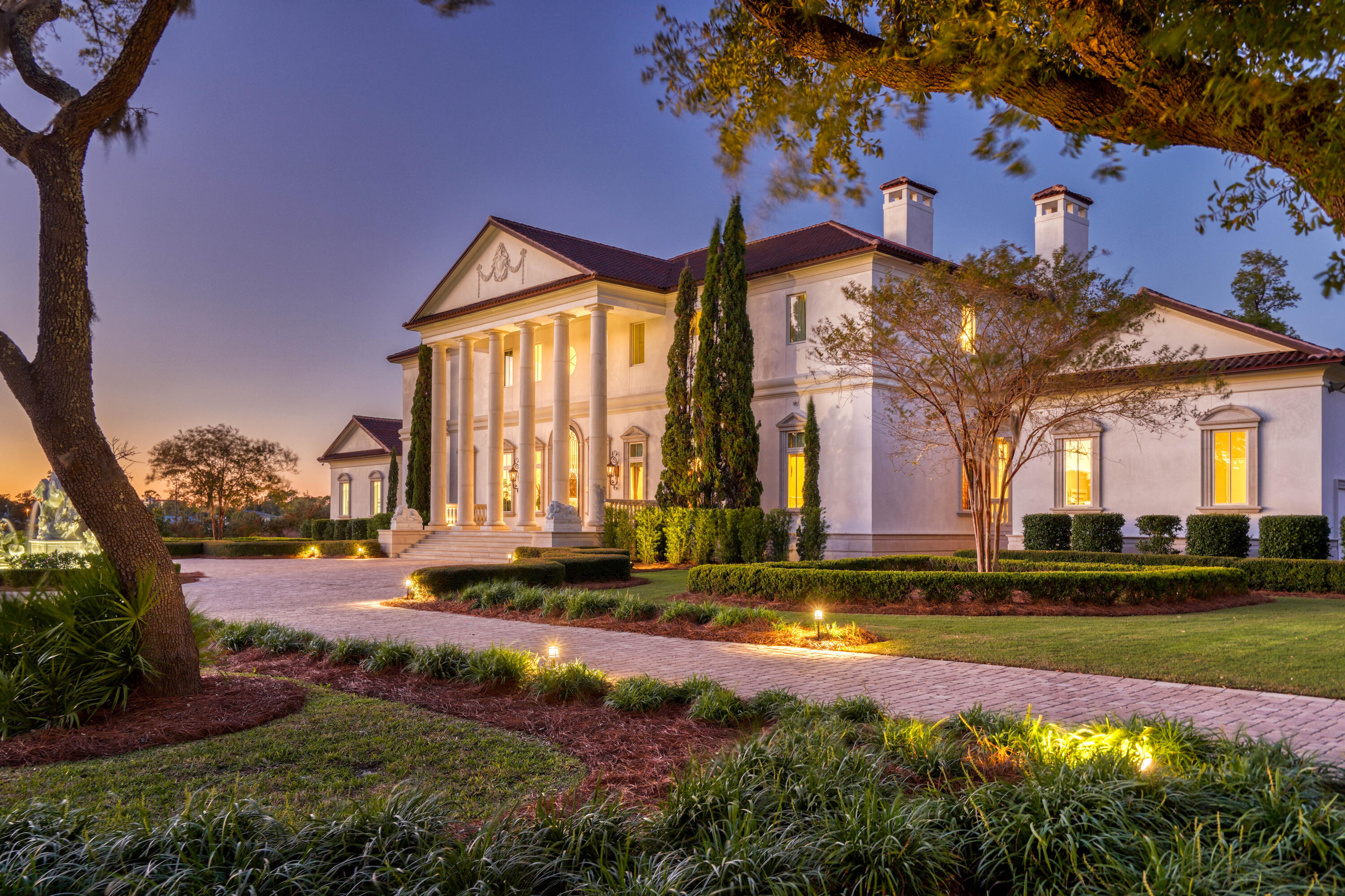 Priced to Sell, Just Reduced $980k! Perched on 3 large lots with 380 feet of water-frontage on the West Bay waters of the Northwest Florida Gulf Coast, this home is inspired by the classic Palladian Villas of the Veneto in Italy, this residence has an architectural integrity and authenticity rarely found in builds today. Architected by Philip Spann of Seagrove Beach and built by Cliff Myers, the home features cushion-cut marble walls, solid stone stairs with balusters crafted of marble, a custom cut marble compass rose inlay in the foyer, and a grand Schonbek Chandelier draped with crystals. The dining room reveals graduated Venetian plasterwork and a custom stone table crafted in Rome outside of the Vatican walls as a striking centerpiece. Every finish and selection throughout this property was carefully sourced and constructed: for example, the walls in the great room are upholstered in silk made in Venice by the Bevilacqua Family, famous internationally for their intricate fabrics. The millwork has a hand applied stri?? to replicate the authentic woodwork of the time. The doorknobs throughout the home are all handcrafted by Baltica with each knob related to all the others in motif. When a material could be sourced from Italy or abroad, it was, giving this home an unparalleled purity of design.(This unique and deliberate customization continues throughout all the rooms of the residence with marble and limestone accents in the great room overlooking the bay. At the heart of the room, find a stunning marble fireplace and note the millwork crafted from individual blocks, perfectly aligned by artisan woodworkers. A media room adjacent to the living room serves as a cozy space to unwind with wood paneled walls and a custom movie theatre size screen with theatre-style lights.(This home has welcomed many guests through its doors for festivities of all types over the years, and the ease of entertaining is evident in the gourmet kitchen with Wolf and Sub-Zero appliances, a breakfast bar, and a separate bar area. A butler's pantry with additional appliances, storage and more provides convenience for preparing all the necessities of large-scale soirees.(As likely anticipated, the second level master suite is suitable for royalty with separate his and hers bathrooms, closets, and offices. The sleeping quarters include gorgeous bay views along with a private columned balcony. Artist Jody Matokovich hand painted the Groin Vault on the ceiling of the bedroom with a style influenced by the frescos of the Renaissance. Each master bathroom offers heated floors and double showers with jets while one is centered around a stunning free-standing bathtub. In addition, the suite includes an exercise room with sauna and a vault plus safe room with ventilation.(Not to be overshadowed by the interiors, the outdoor spaces of the Villa Chimera are equally enchanting. A towering iron gate secures the property which features over 3 beautifully landscaped acres and 380 feet of waterfront on West Bay. A marble fountain at the entry of the residence carved and transported from Italy depicts figures from Greek mythology including the Chimera, a fire-breathing, three headed monster. Highlights of the rear yard entertaining spaces are a heated infinity pool with spa overlooking the bay, an outdoor air-conditioned kitchen, a firepit, and a shallow dock to the bay.(In addition to the spaces referenced, the property includes two guest suites in the main home, a detached carriage home and a four-car garage each connected to the main home by breezeways, and a generator room with gas generator. A fully integrated smart house, a Creston whole house lights and media system controls everything with tablets while monitored security cameras are installed on the exterior.