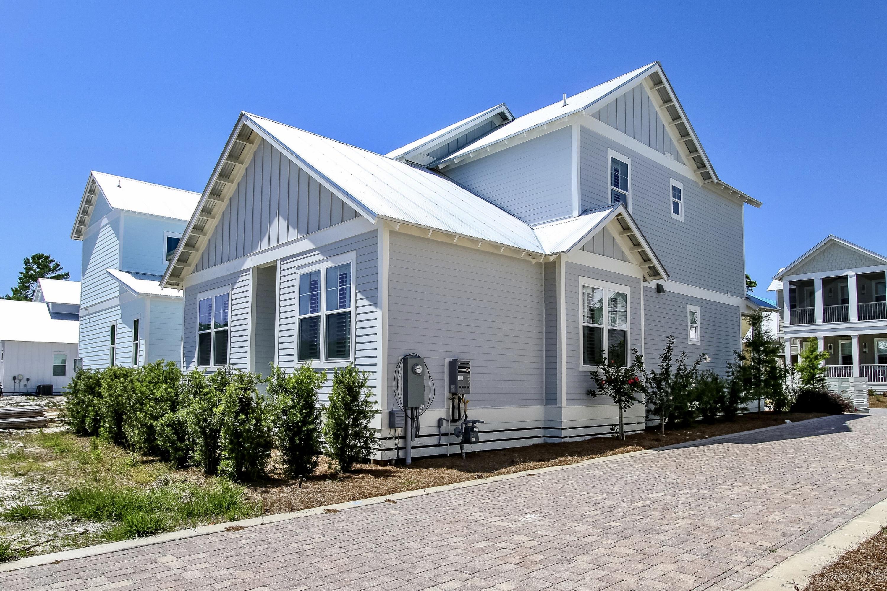 Tupelo floor plan at The Village at Grayton Beach is a charming coastal cottage with a perfect layout for a beach getaway. This home has an open concept kitchen, dining, and living with plenty of natural light and functional living space: the epitome of a cool beachside town. Bordered by Grayton Beach State Park to the east & Point Washington State Forest to the north and west. Unparalleled beauty and coastal charm is the essence of The Village at Grayton Beach. Walk, bike or ride to the shining turquoise waters of the Gulf of Mexico. The elegant coastal community also offers an outstanding zero entry community swimming pool with waterfall feature. For further information For more information on this Incredible Home PLEASE refer to PHOTOS & DOCUMENTS.Buyer to verify all information.