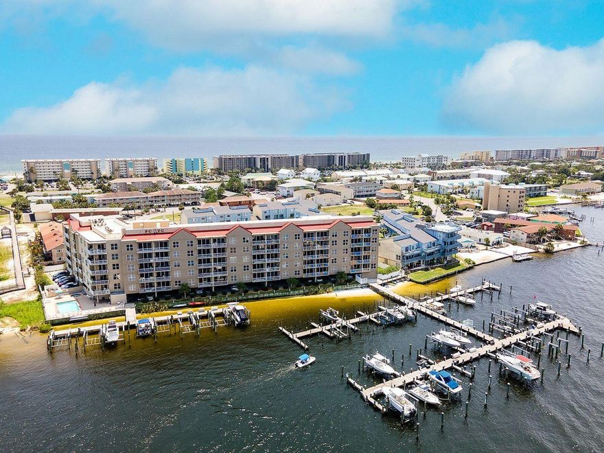 Okaloosa Island! - Bring your boat!! This waterfront Condo gives you beautiful water views and a great spot to watch all the boats as they cruise the intercoastal waterway as well as a front row seat to all the fireworks shows at the landing. And it includes a deep water boat slip with the option of one that will accommodate up to a 42ft boat. This unique gated condo community features great amenities including a heated pool, hot tub, grilling area, lockers, and covered parking. And this condo is VA approved! This secret hideaway on Okaloosa Island puts you in the middle of it all while feeling like you are a million miles away. No need for an elevator, as there is 2nd level parking for this unit. Appliances updated in 2019 **Allows Short Term Rentals**