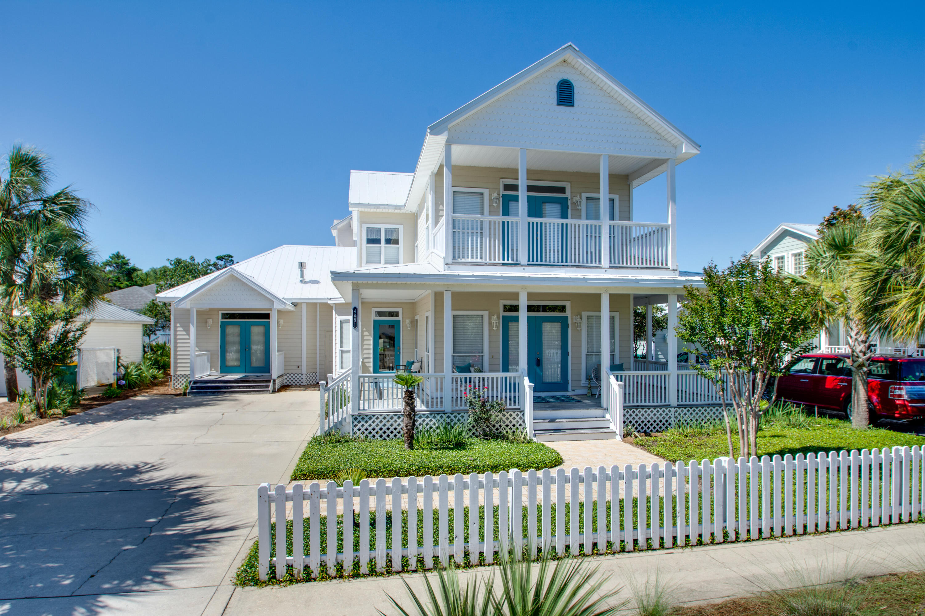 Charming beach cottage in much desired Crystal Beach. This beautiful home features two master bedrooms and baths. One downstairs and one upstairs. Tons of storage and closet space throughout. The master down stairs features a fireplace and large bath with walk in shower, and walk in closet. This home is a 4 bedroom, or 3 bedroom with an den/nursery/library/office. The living room is large and open with a fireplace. Upstairs bedroom has a walkout balcony and large bath with over sized tub. Downstairs has a semi wrap veranda. Home has been well maintained and all interior has been freshly painted. Very bright and charming, with many windows, crown molding, and tall ceilings.