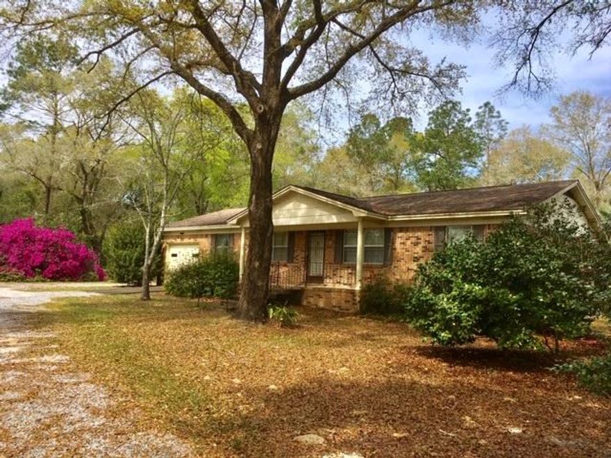 BRICK RANCHER ON 3.3 ACRES! Conveniently located just 3 miles north of DeFuniak Springs, this sturdy brick ranch house sits at the top of a hill on 3.3 cleared and wooded acres. The 3 BR / 2 BA home is in good shape, but the dcor needs updating and a little love. The interior features a Living Room and a Den, and the Master Bath has a walk-in handicap equipped shower. Outside, there is an attached garage, a detached 2-car pole-barn/carport, a metal storage building, and a spacious covered back deck with attached handicap ramp. The yard is partially cleared and features a variety of trees and flowering shrubs. Priced BELOW a recent appraisal, this property offers infinite possibilities at an excellent price. All dimensions and square footage to be verified by Buyer at Buyer expense.