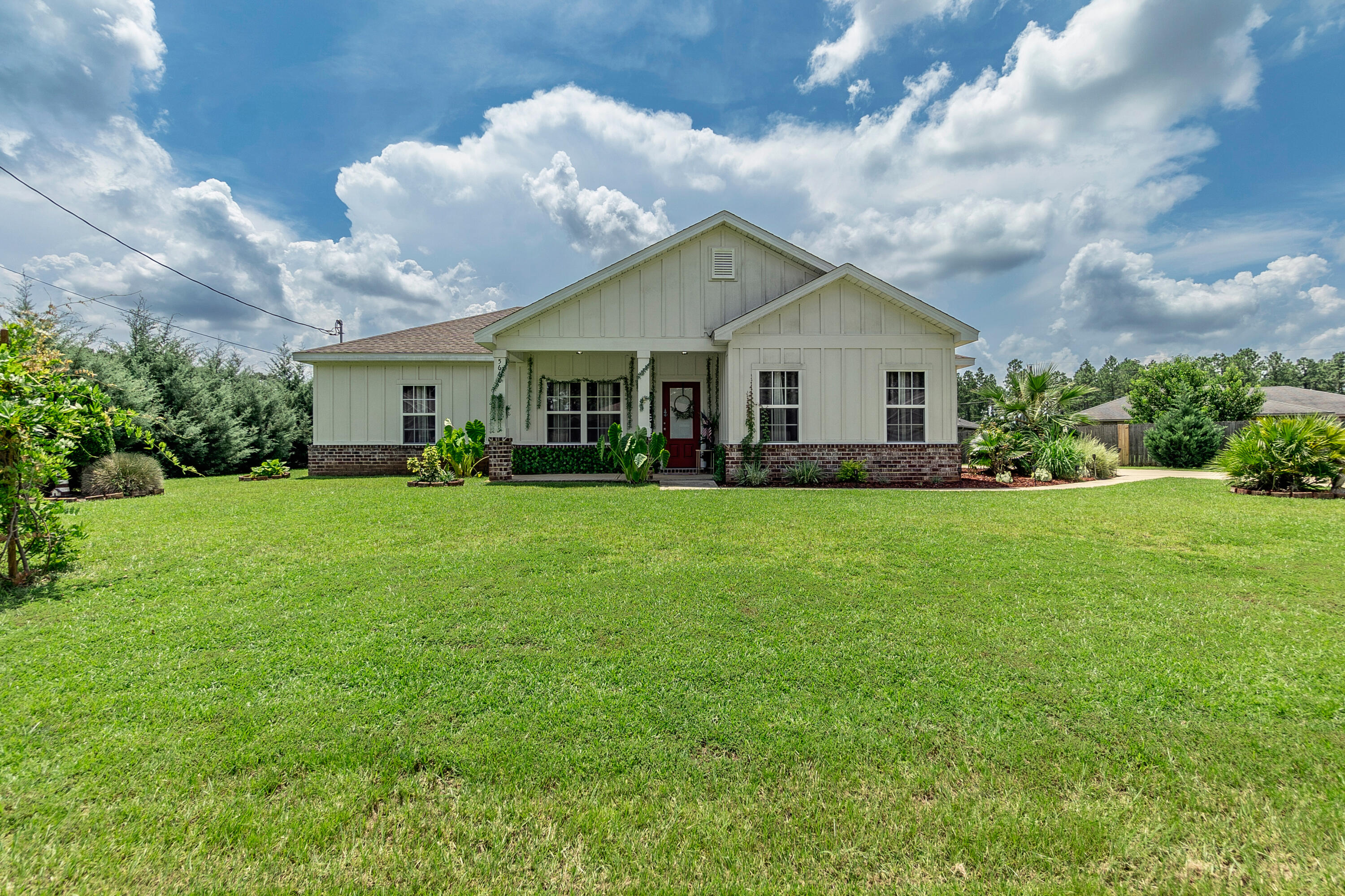 Discover the perfect blend of classic charm and contemporary convenience in this beautifully maintained Craftsman-style home. Built in 2020, this 3-bedroom, 2-bathroom gem boasts exquisite brick trim and stylish board-and-batten siding, setting a welcoming tone right from the curb.Step inside to find soaring 9' ceilings and an open-concept living, dining, and kitchen area, ideal for entertaining and family gatherings. The heart of the home features a sleek kitchen with a large work island, granite countertops, and a spacious pantry--perfect for any home chef.