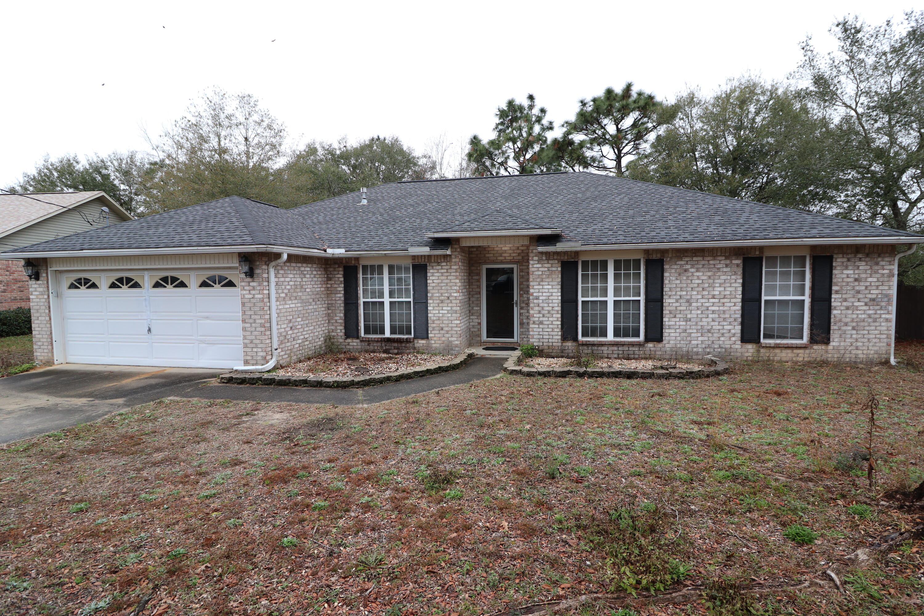 Great South Crestview Location! This all brick home has a 2018 roof with Populus Solid Surface countertops as well as tile flooring in the kitchen and bathrooms. The living room has a vaulted ceiling, a gas burning fireplace and a ceiling fan. The kitchen has a large pantry, a large island and a breakfast nook. There is also a formal dining room with wainscoting. All bedrooms are spacious and come with ceiling fans. The master bathroom has a tiled shower, soaking tub, double vanity and a walk-in closet. There is a separate laundry room with closet. The back porch is screened in with a ceiling fan along with a two car garage and pulldown attic stairs for extra storage. The garage also has an attic fan to help exhaust the heat.