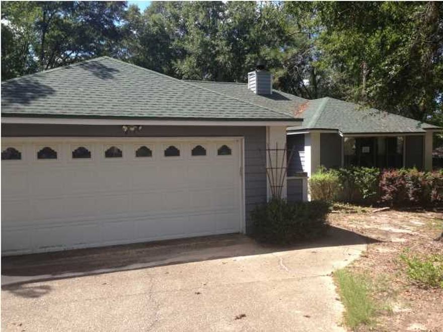 Enjoy nature from this naturally landscaped home in the golf course neighborhood of Foxwood Country Club. You'll love the open floor plan. Cathedral ceiling and brick fireplace accent the family room that opens to the expansive wood deck. Enjoy the wooded privacy-fenced backyard with lots of azaleas, crepe myrtle, and dogwood. A large bay window accents the front of the home and gives the living room an added dimension. Lots of kitchen cabinets plus a breakfast bar and pantry. The master bedroom opens to the deck for backyard enjoyment. Large vanity and walk-in closet in the master bathroom. Both bathrooms have skylights. All wet areas have tile flooring. Laminate flooring in the hallway, vanity area of the master bath, and one bedroom. Outside the city limits so save on taxes!