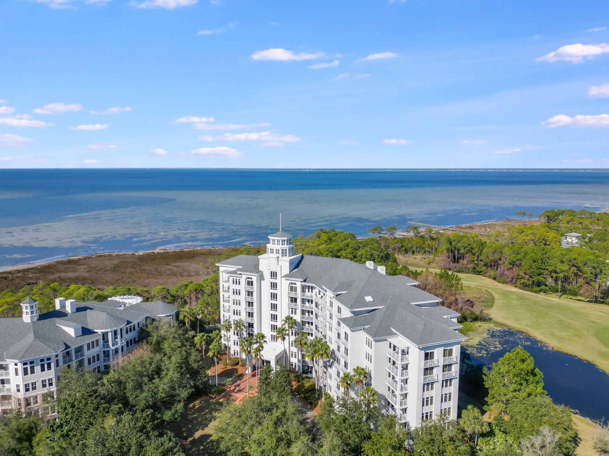 Welcome to the Sandestin Golf and Beach Resort! This private condo is just a short walk from Baytowne Wharf, offering both comfort and convenience. Featuring LVP flooring and stylish furnishings, this unit provides a peaceful retreat with views of the 12th hole at Burnt Pine Golf Course, as well as a scenic wildlife preserve that will delight birdwatchers. In the distance, you'll also enjoy a partial view of the Bay. Residents of Elation have access to the Solstice Club, along with one garage parking space. Don't miss out on this exceptional opportunity!